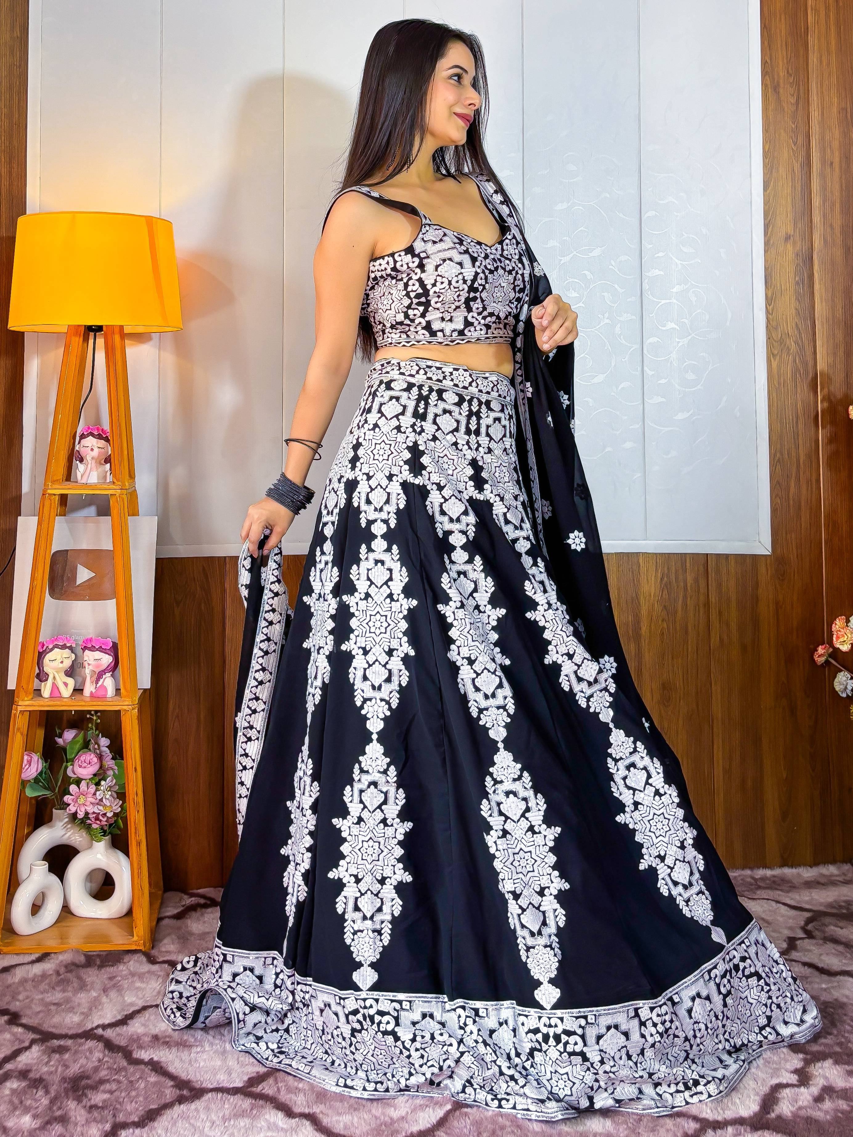 Black and white embroidered lehenga choli with intricate patterns, perfect for Indian ethnic wear occasions.