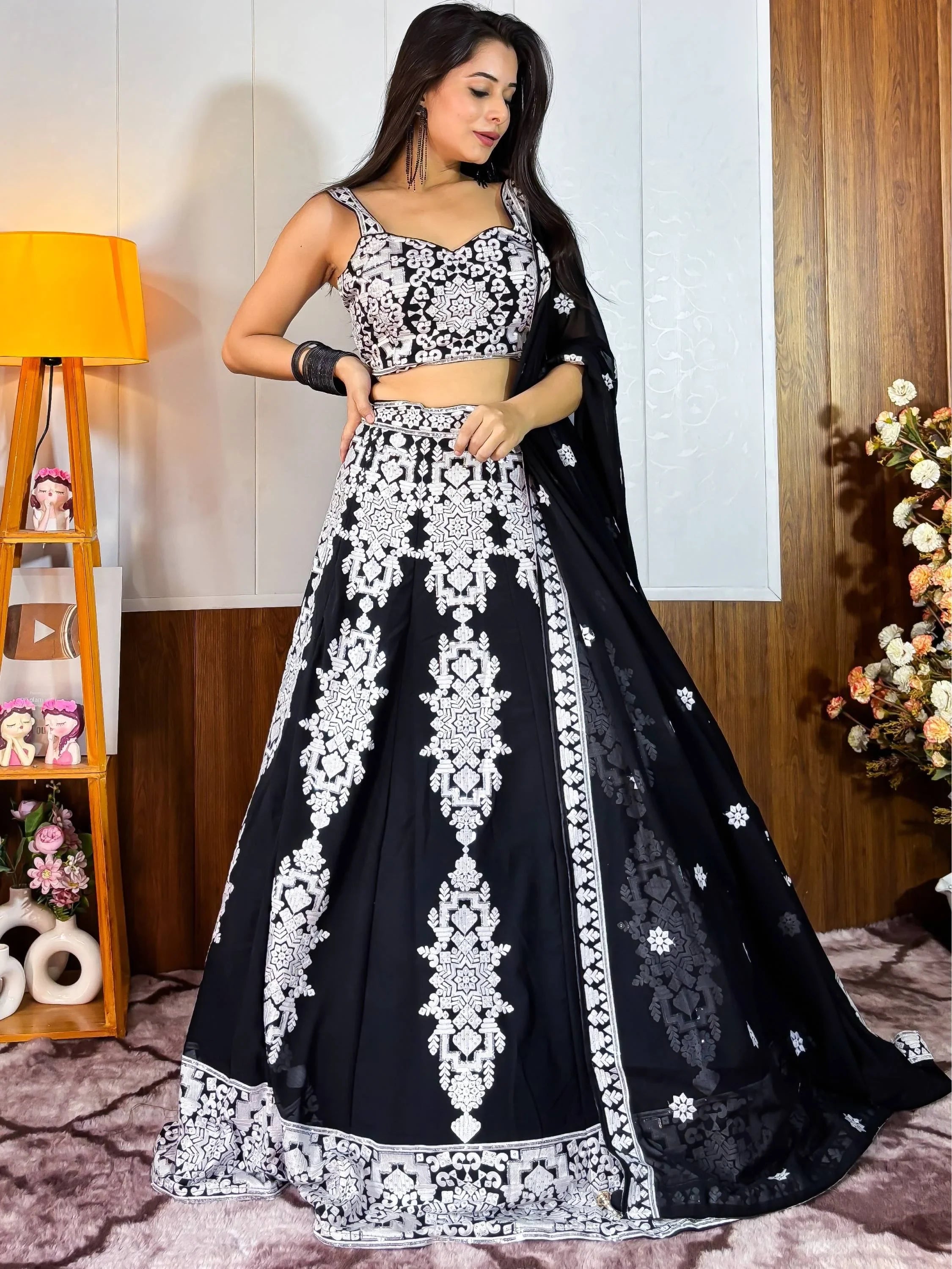 Black and white embroidered lehenga choli with floral motifs, perfect for Indian ethnic wear occasions