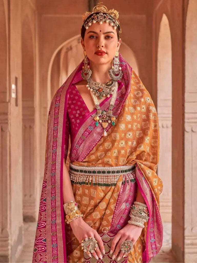 Enthralling Mustard Yellow Patola Printed Silk Traditional Saree