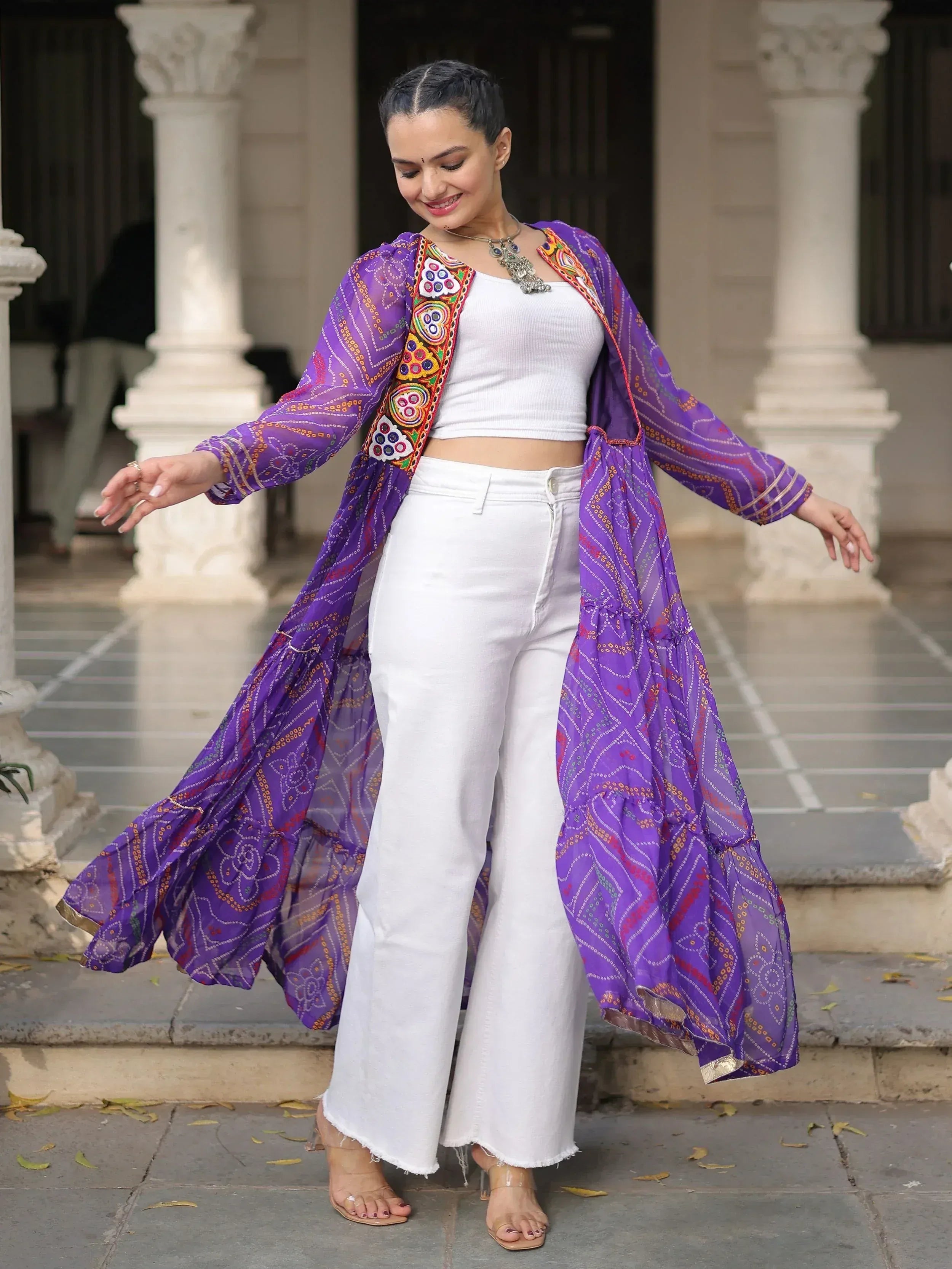 Purple embroidered ethnic jacket with white crop top and wide-leg pants, perfect for Indian fusion wear