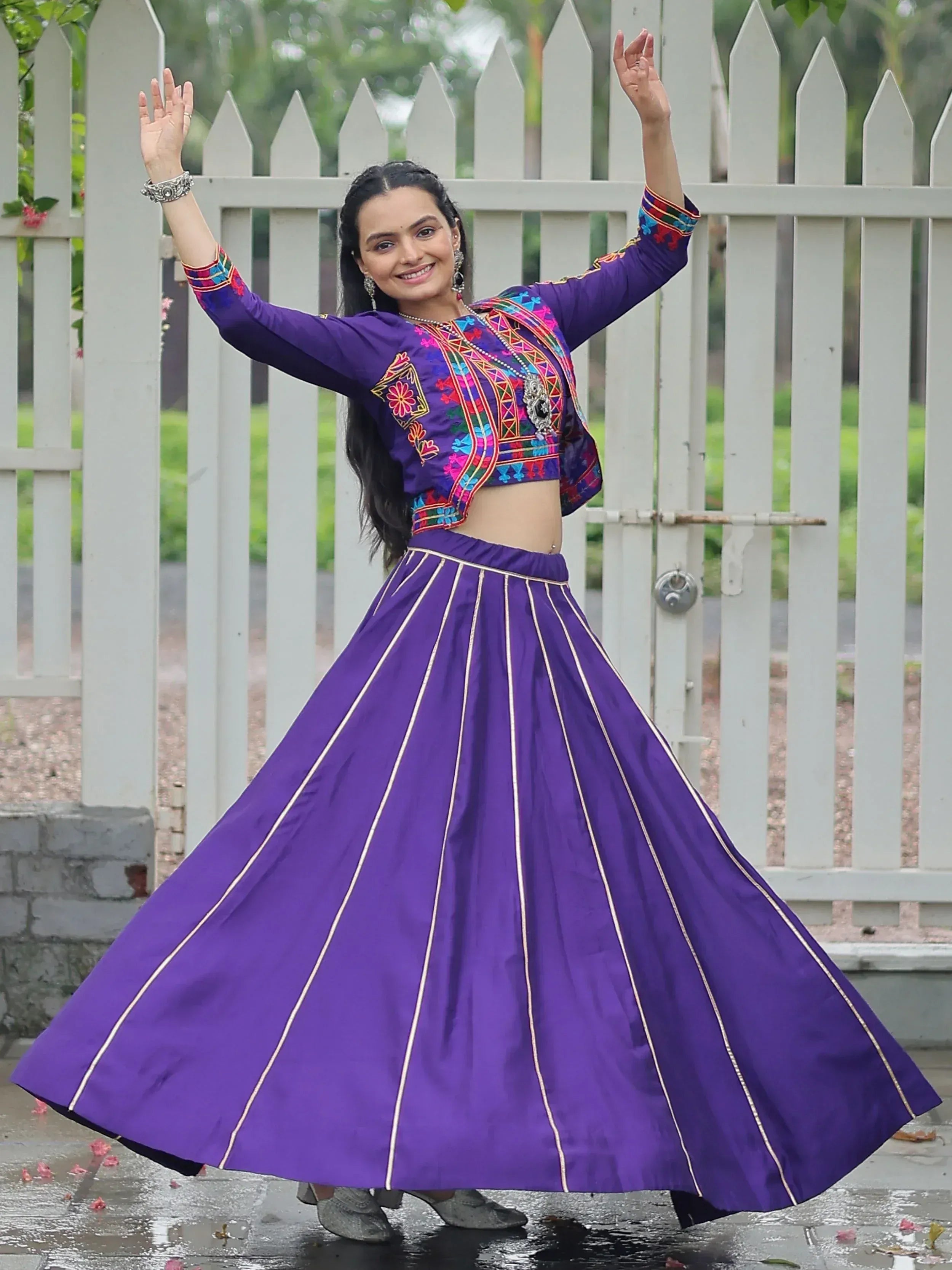 Purple embroidered lehenga choli with flared skirt, perfect for Indian ethnic wear and festive occasions.