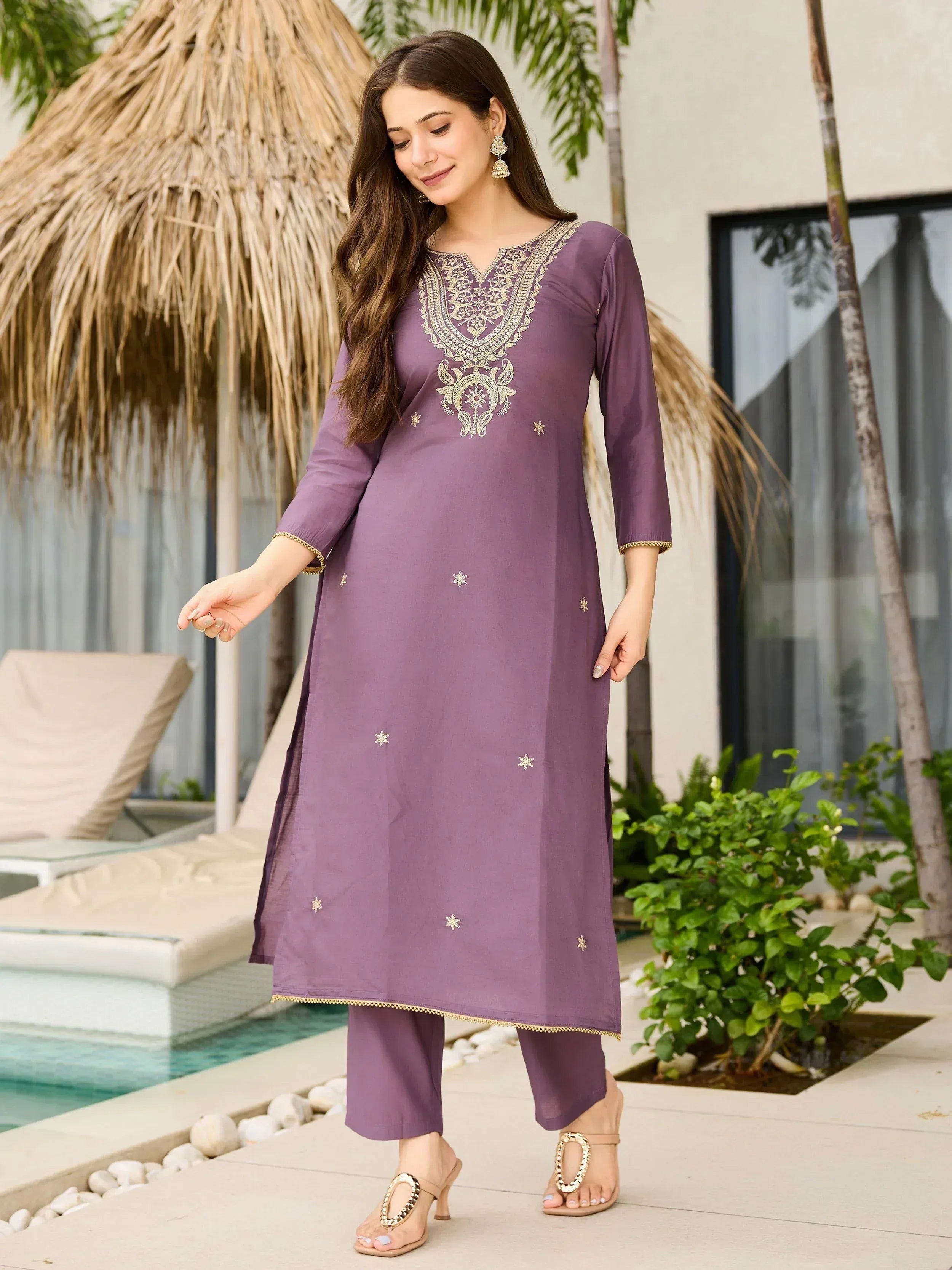 Purple embroidered ethnic kurta set with gold detailing, perfect for Indian festive occasions