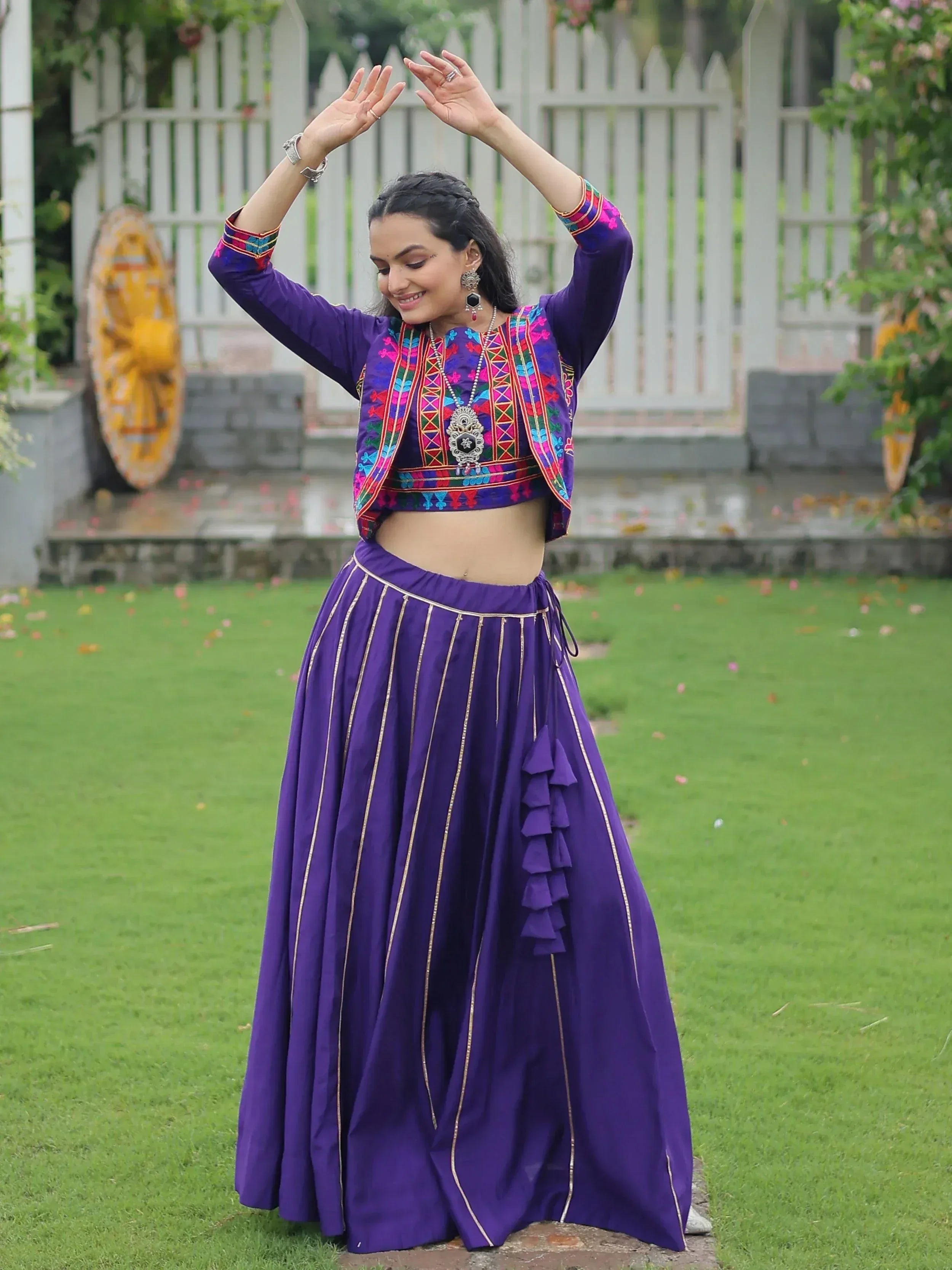 Purple embroidered lehenga choli with ruffled skirt, perfect for Indian ethnic wear occasions