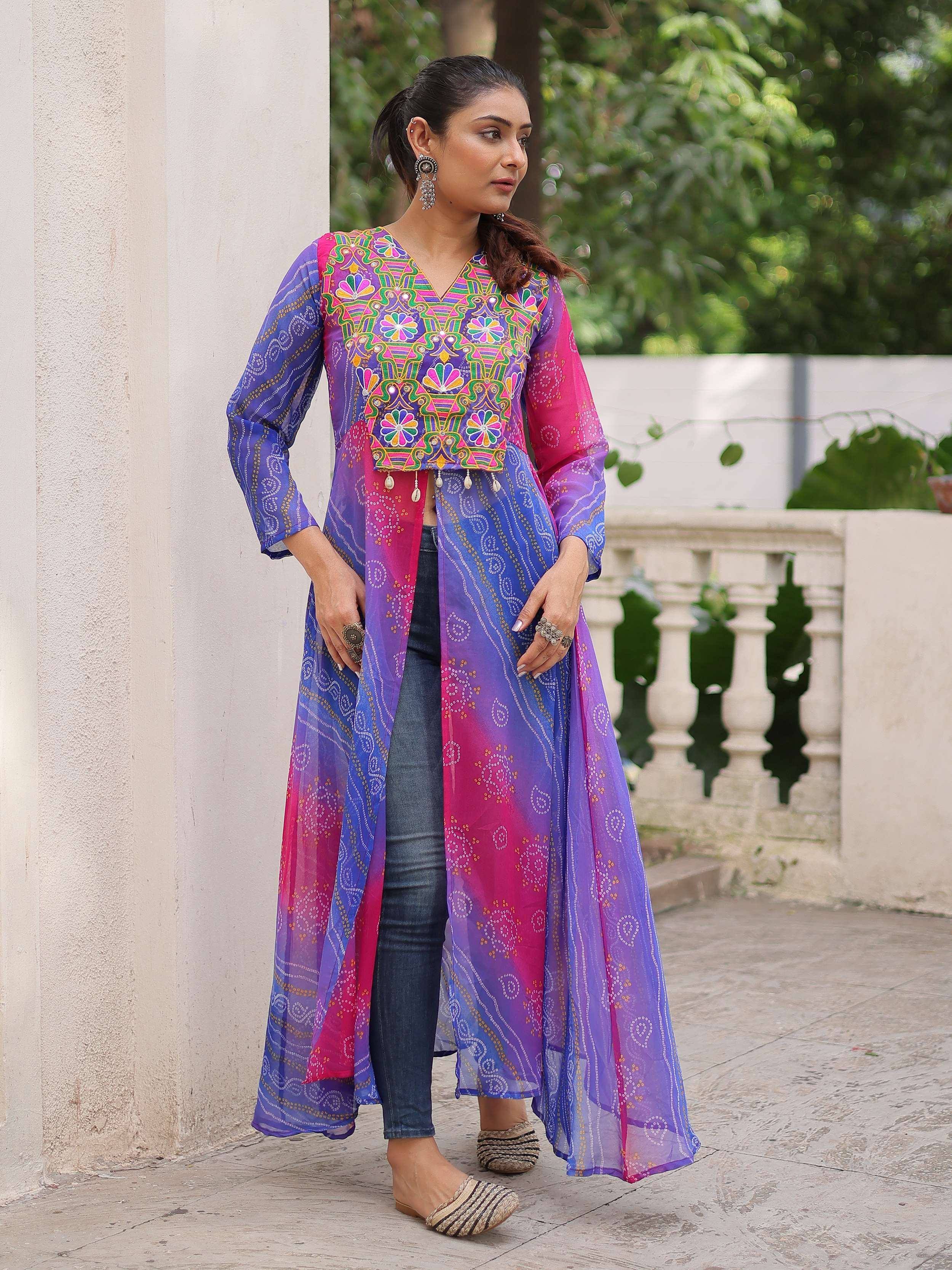 Colorful embroidered ethnic long jacket with mirror work, paired with jeans for modern fusion style
