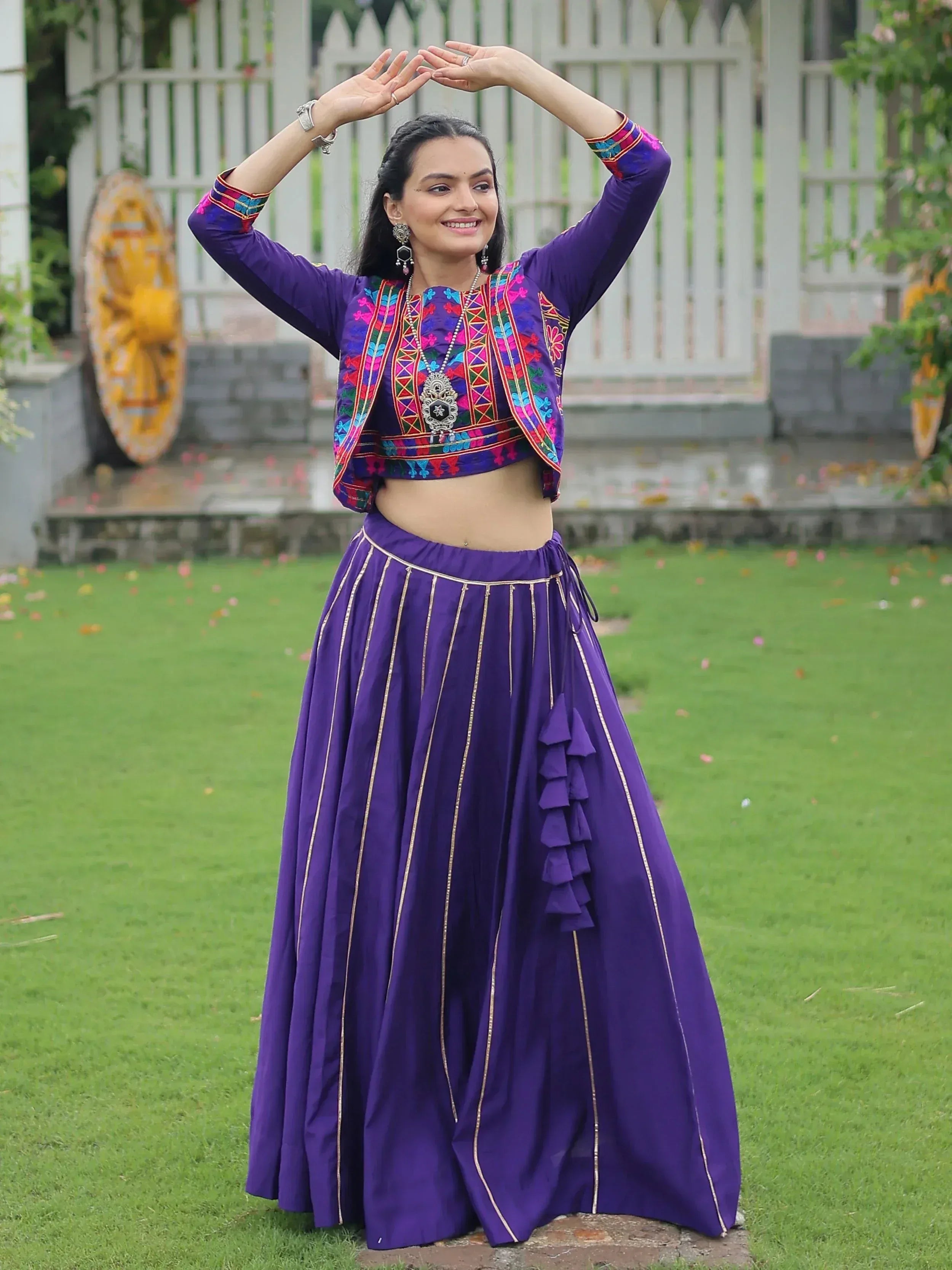 Purple embroidered lehenga choli with ruffle skirt, perfect for Indian ethnic wear and festive occasions.