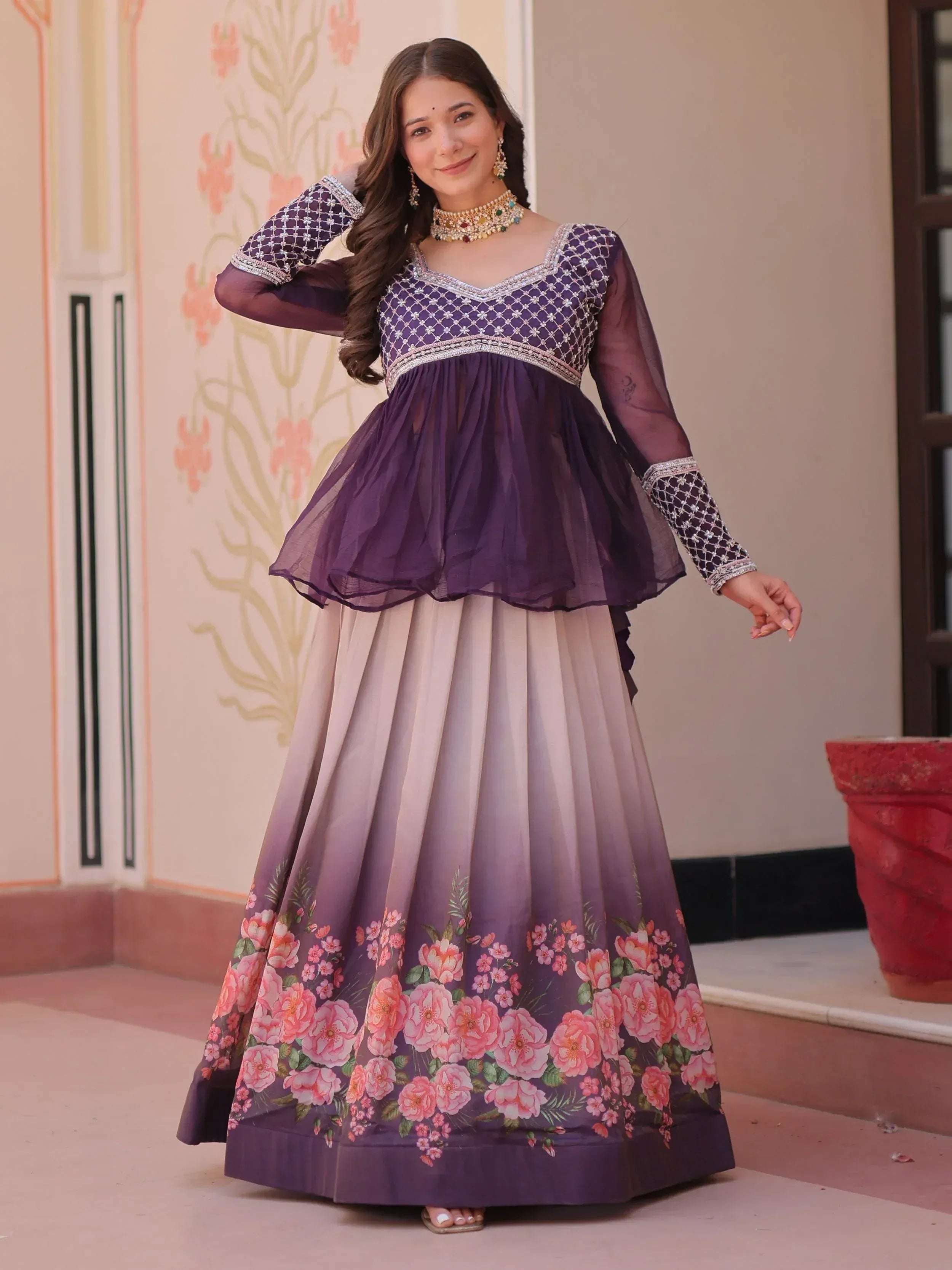 Purple floral print ethnic gown with embroidered net top and pleated skirt, perfect for Indian occasions