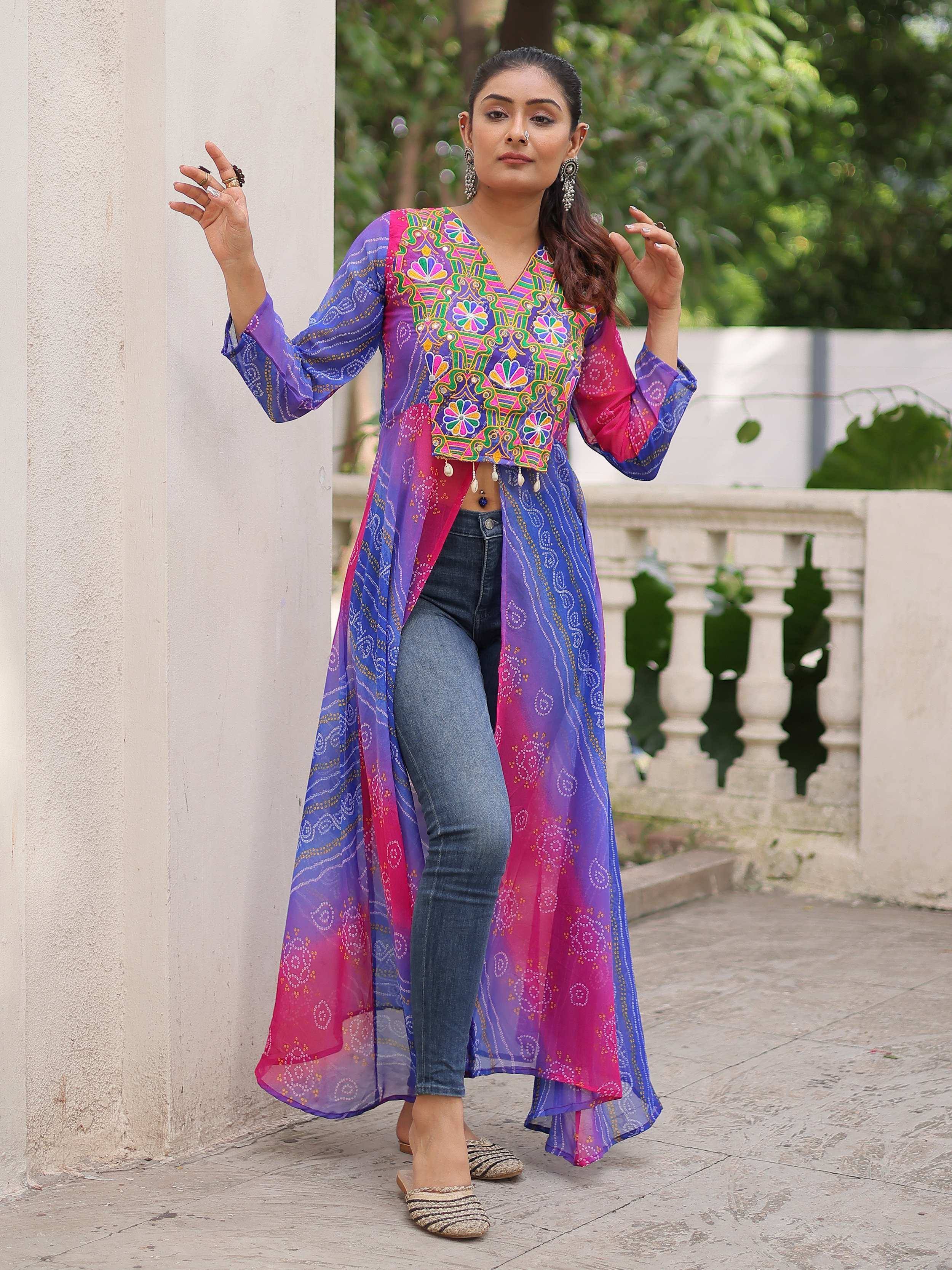 Vibrant embroidered Indian ethnic long jacket with colorful patterns, paired with jeans for fusion style