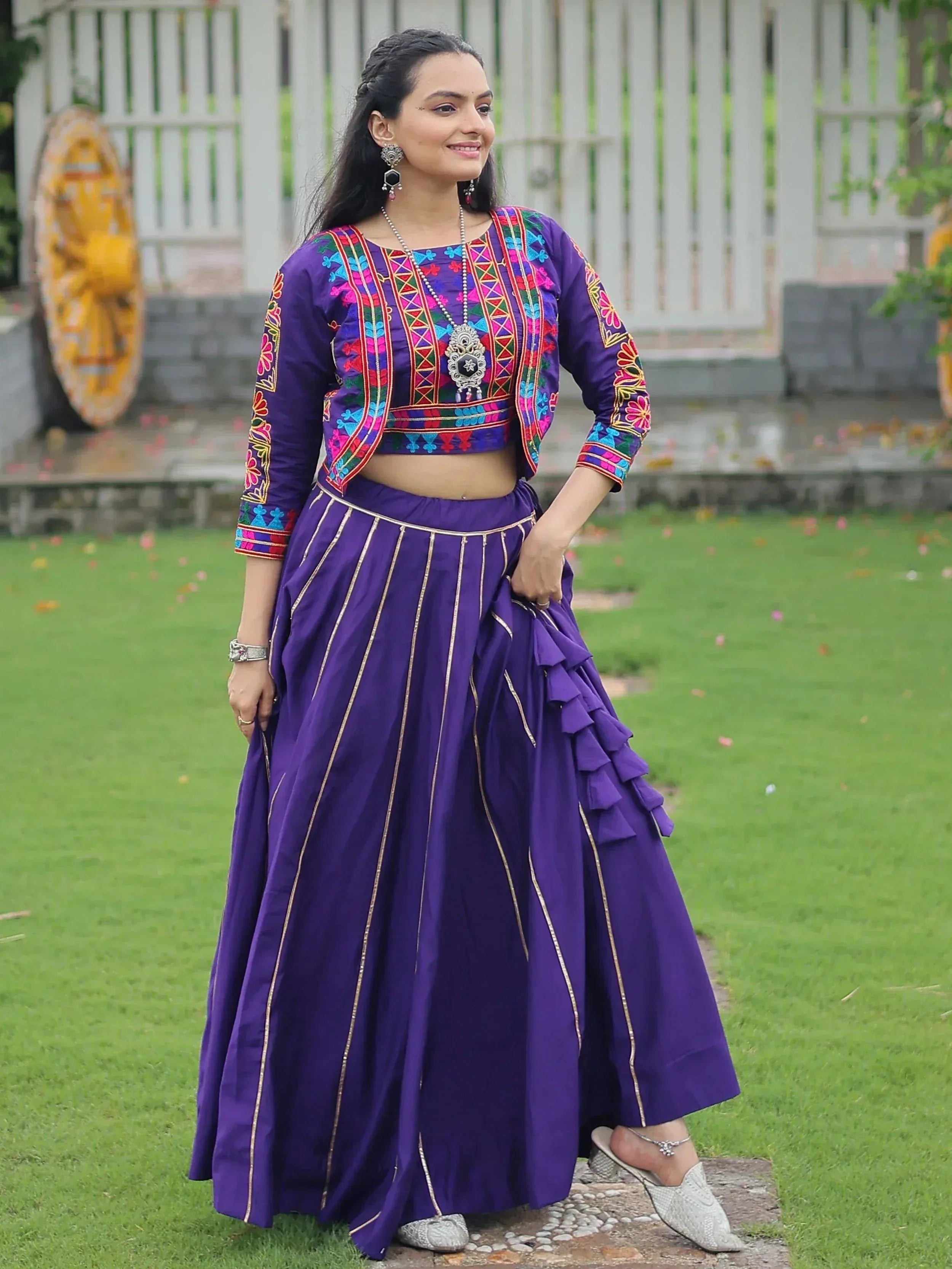 Purple embroidered lehenga choli with ruffle skirt, perfect for Indian ethnic wear and festive occasions.