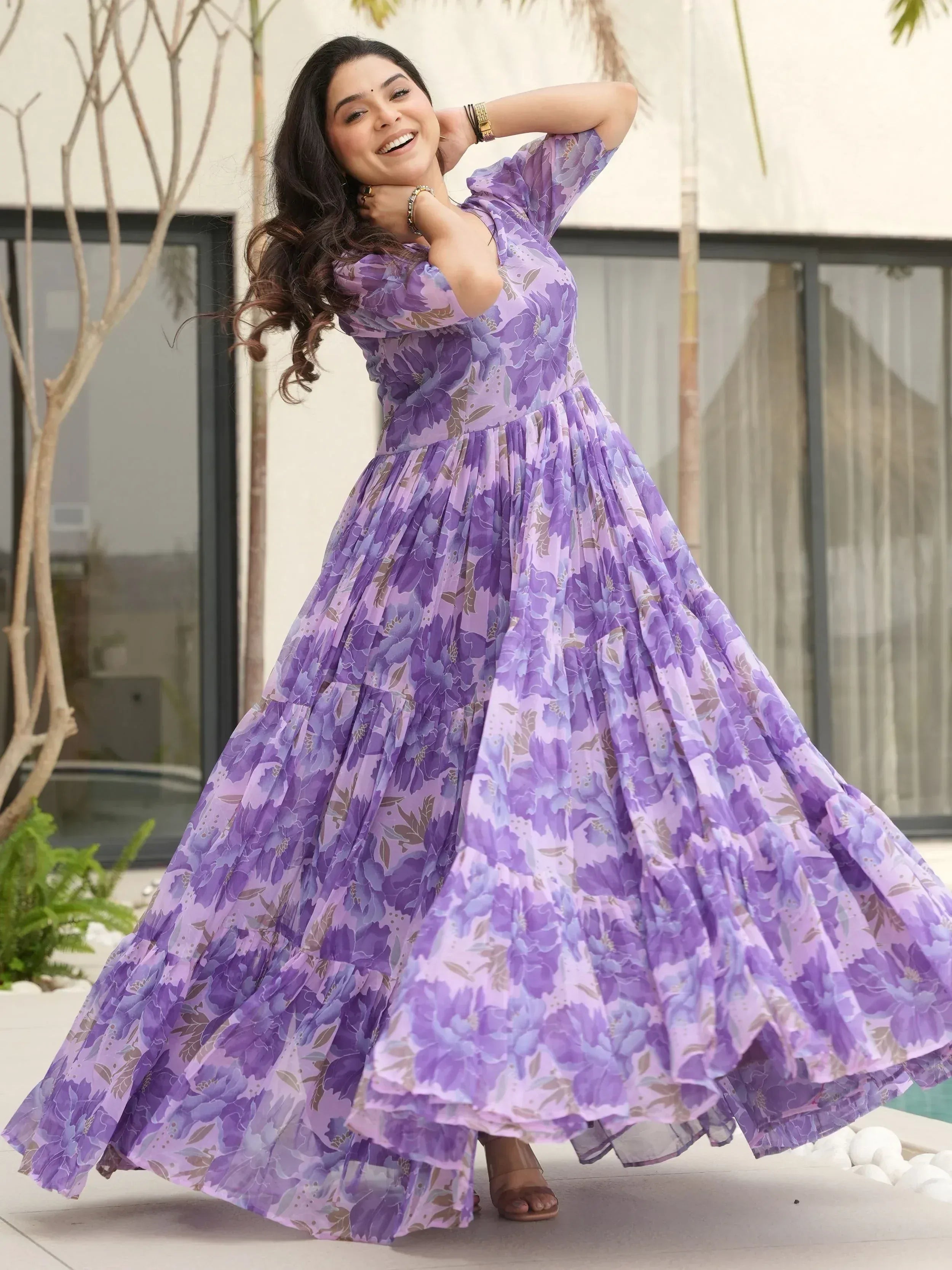 Purple floral ethnic gown with pleated skirt, perfect for Indian occasions and festive wear.
