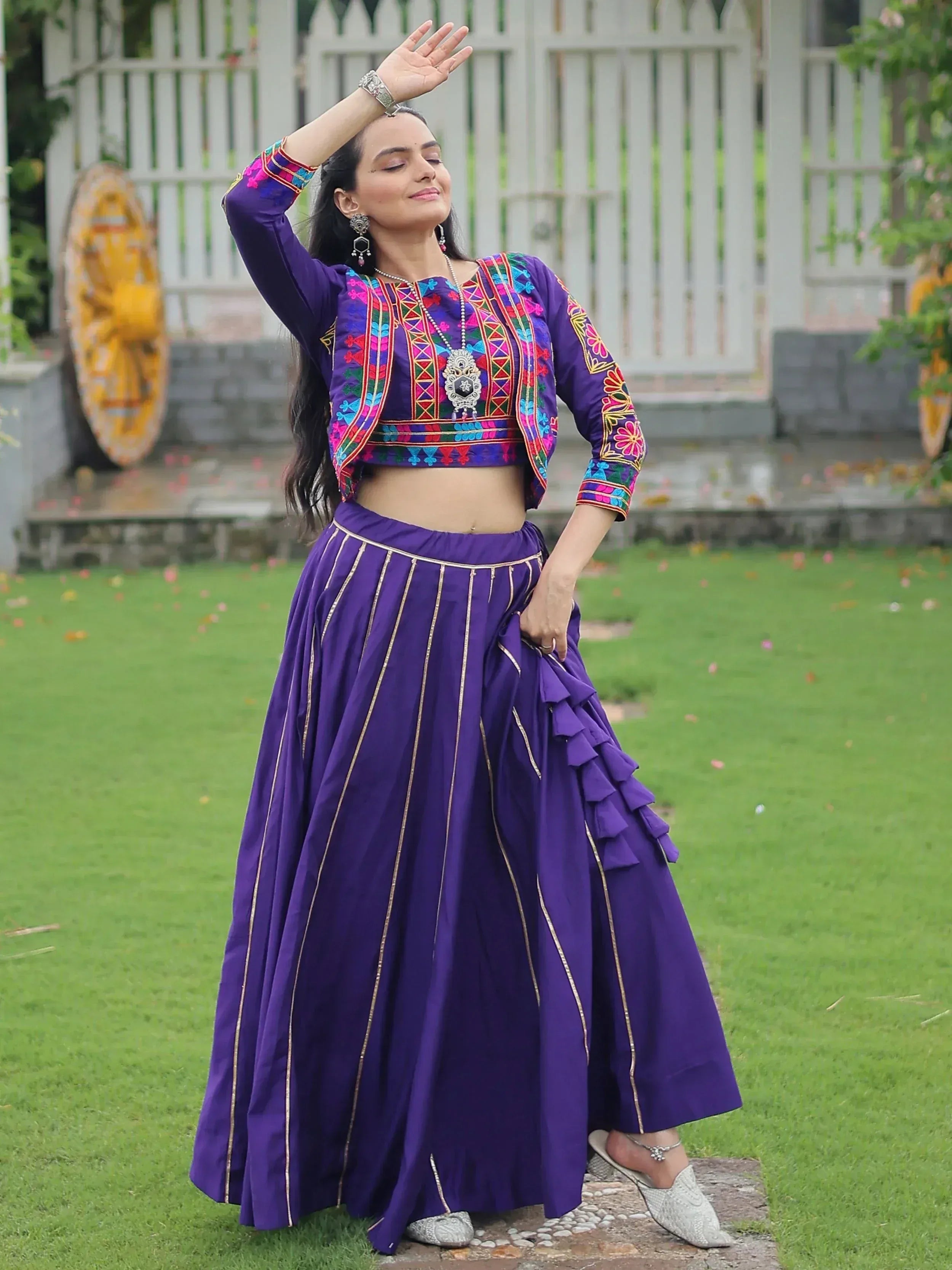 Purple embroidered lehenga choli with ruffle skirt, perfect for Indian ethnic wear and festive occasions.