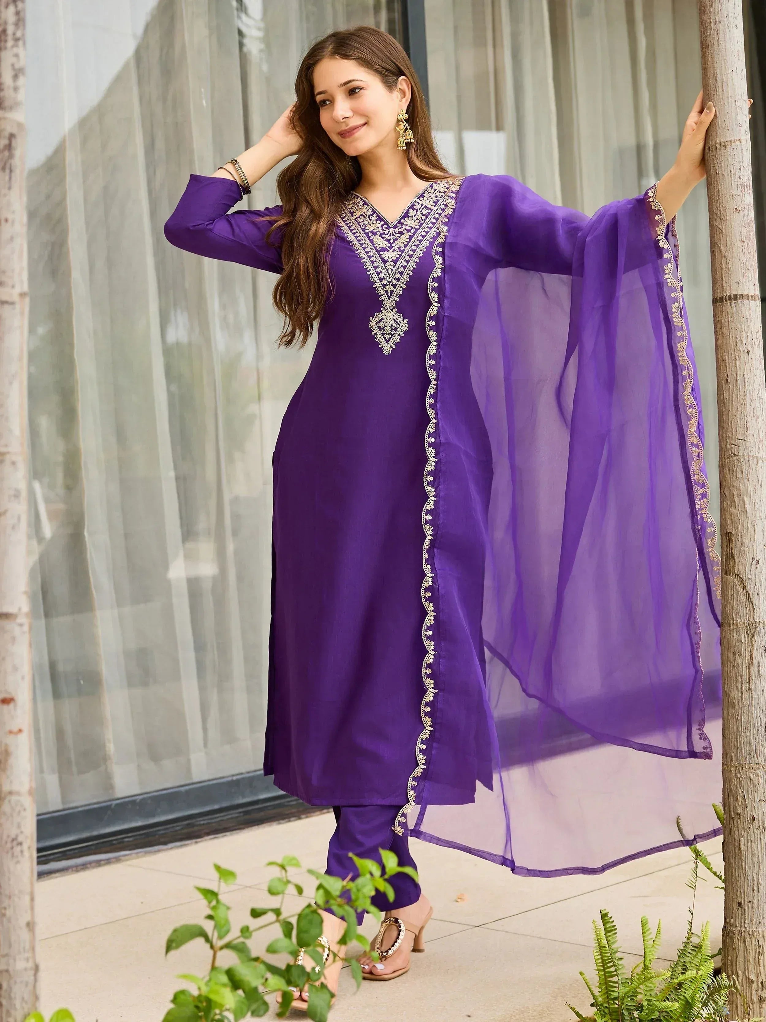 Purple ethnic kurti with gold embroidery and sheer dupatta, styled with palazzo pants for festive occasions