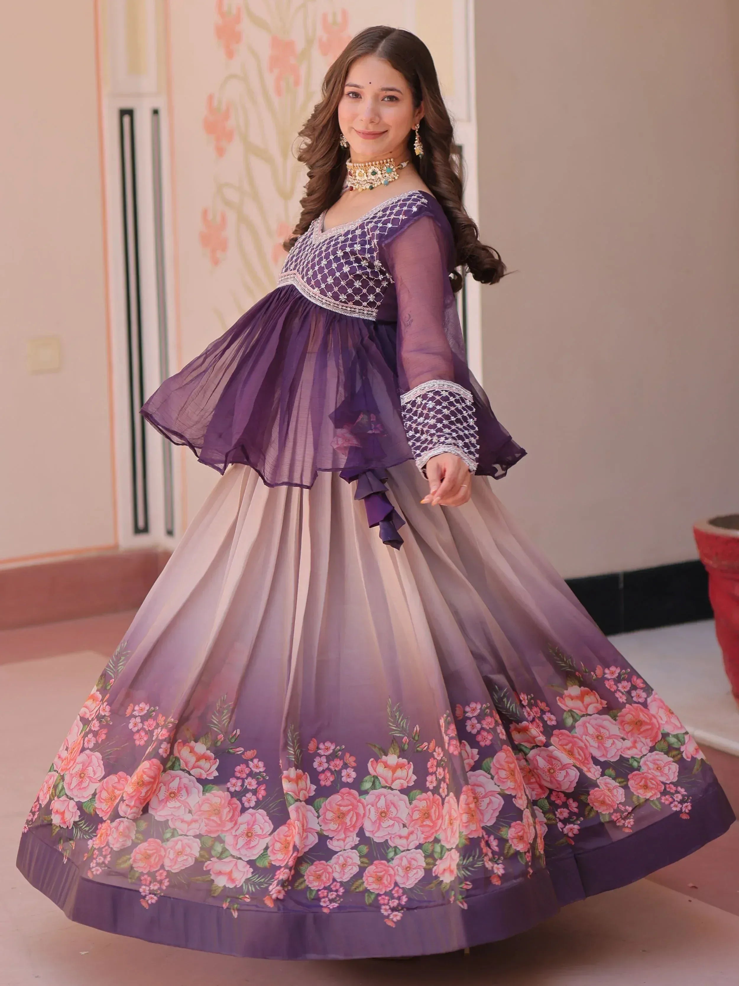Purple floral ethnic gown with net overlay and embroidery, perfect for Indian occasions