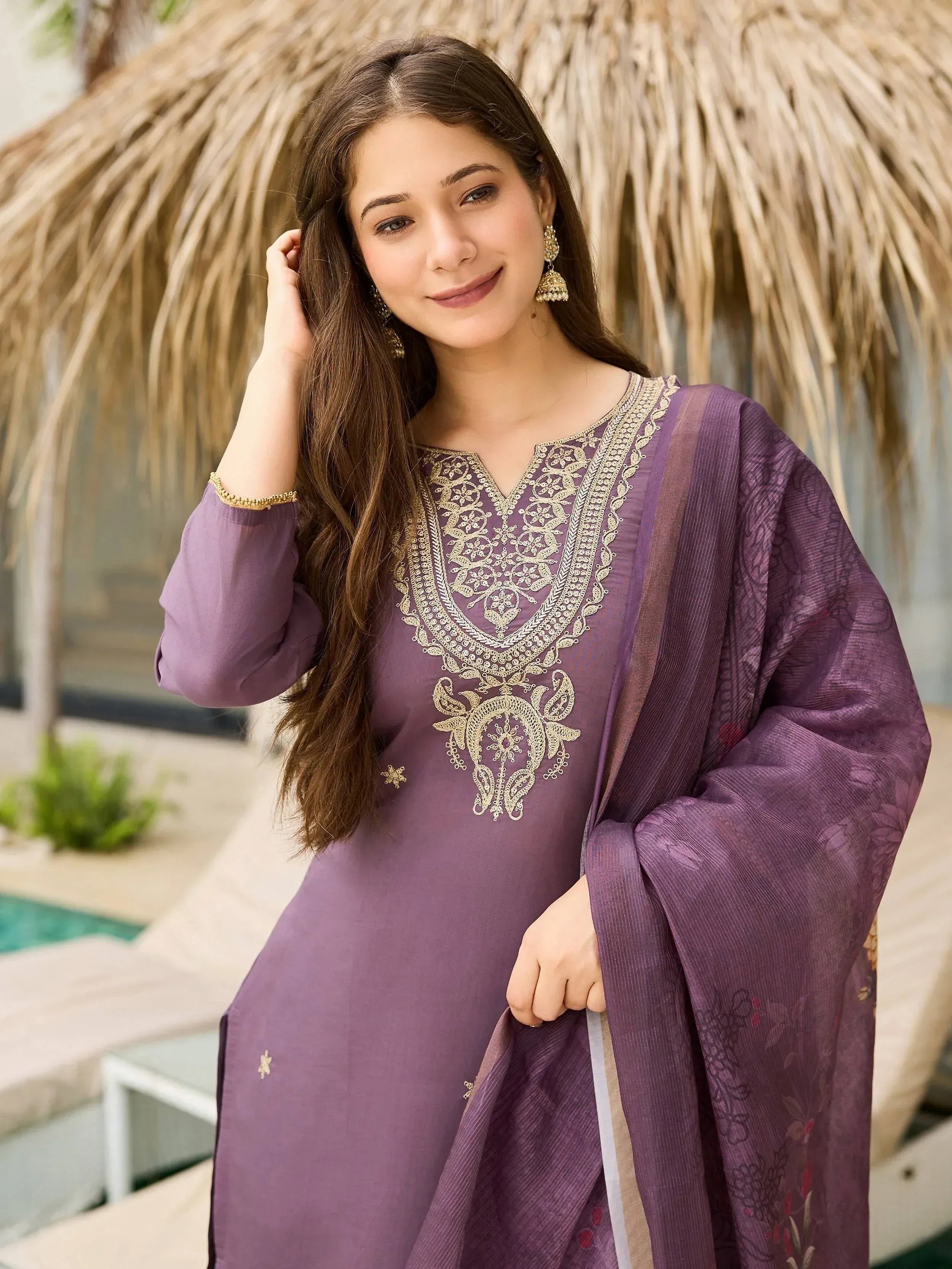 Purple embroidered salwar kameez with gold detailing, perfect for Indian ethnic wear