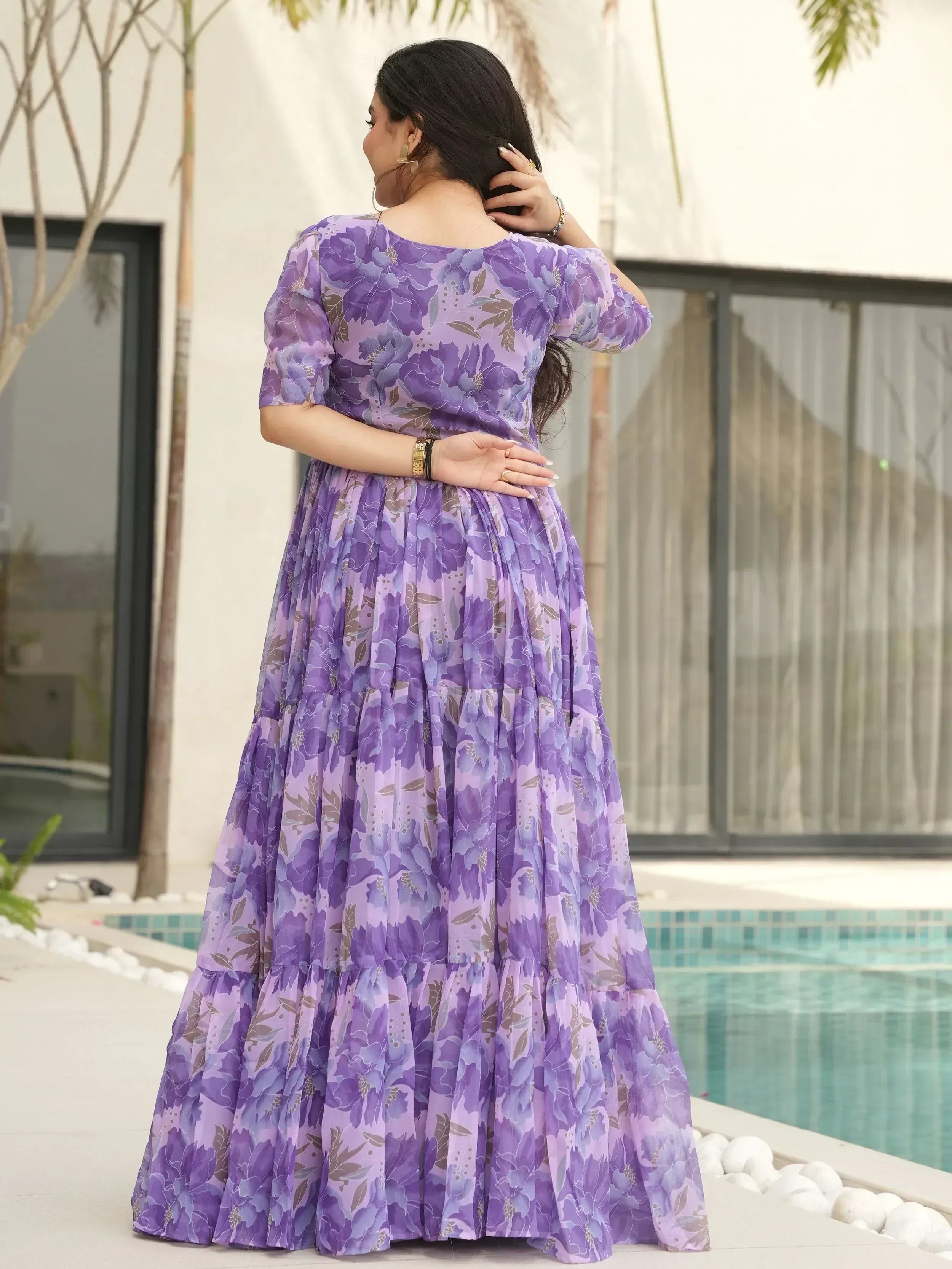 Purple floral ethnic gown with tiered skirt, perfect for Indian occasions and festive wear.