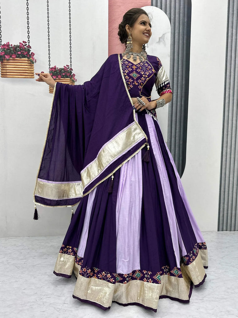 Purple and lavender ethnic lehenga choli with gold embroidery and dupatta, perfect for Indian weddings and festivals