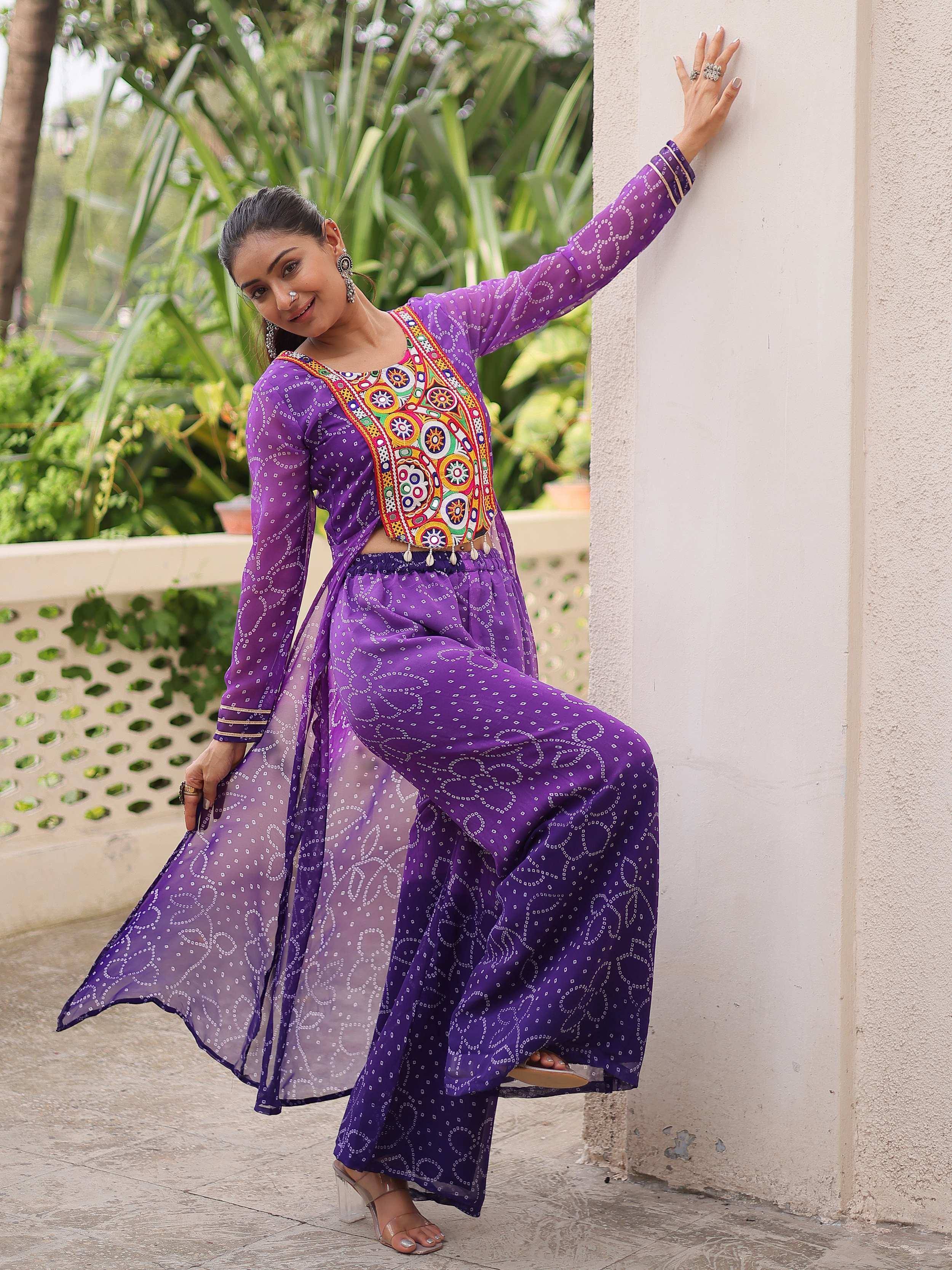 Purple ethnic wear with colorful embroidery, perfect for festive occasions