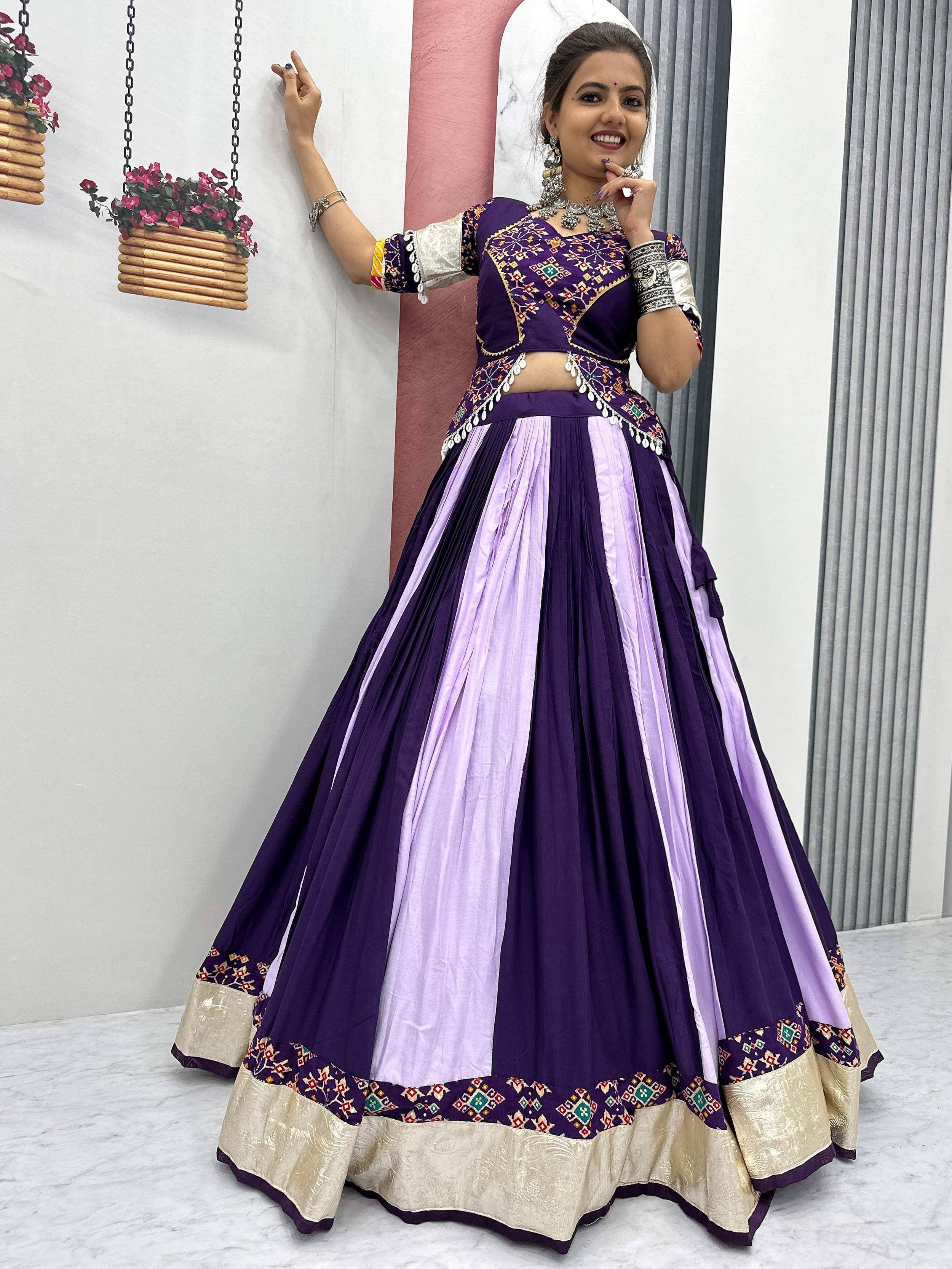 Purple and lavender embroidered lehenga choli with mirror work, perfect for Indian ethnic wear occasions.
