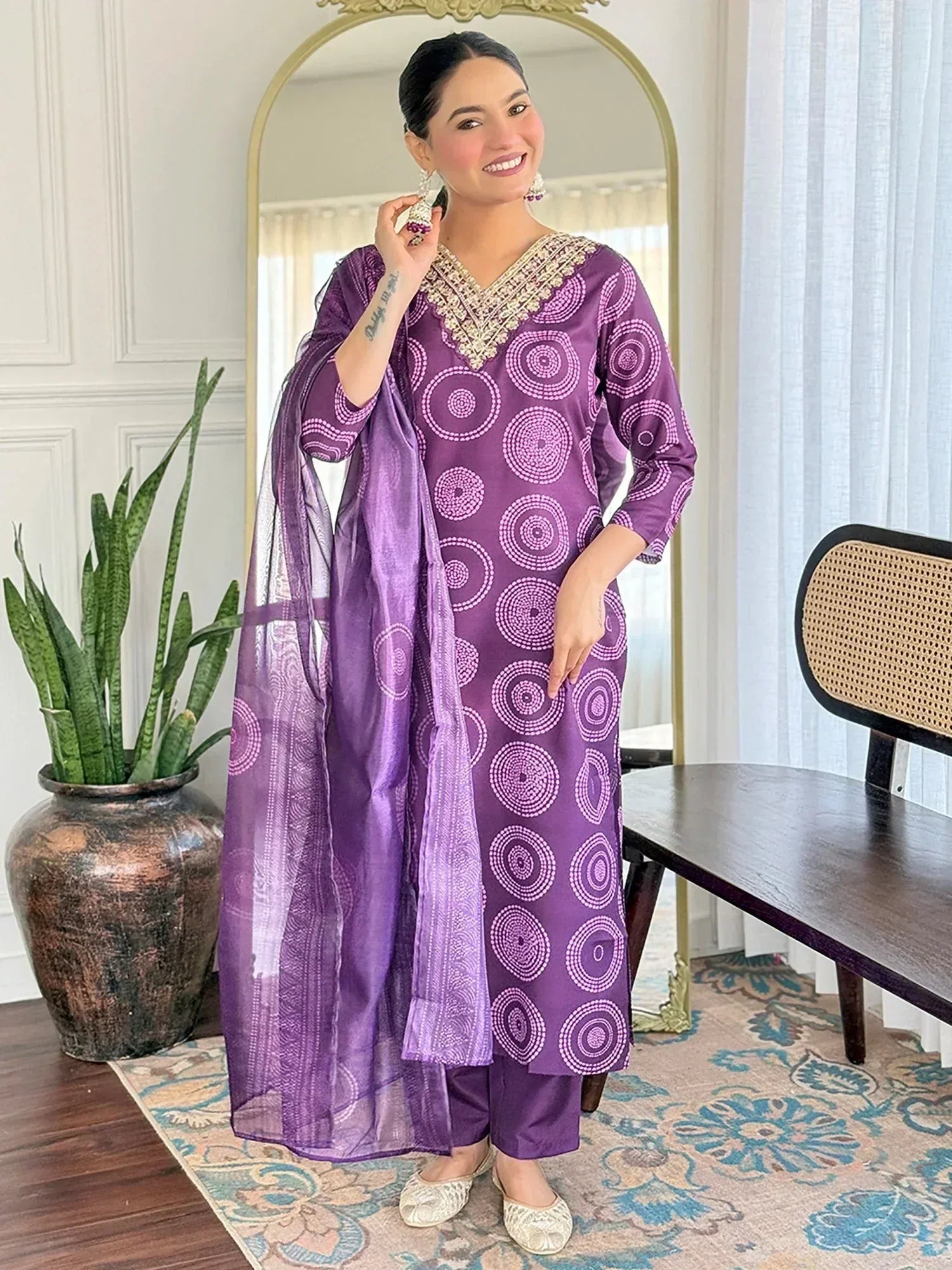Purple printed salwar kameez with embroidered neckline and matching dupatta, ideal for ethnic wear