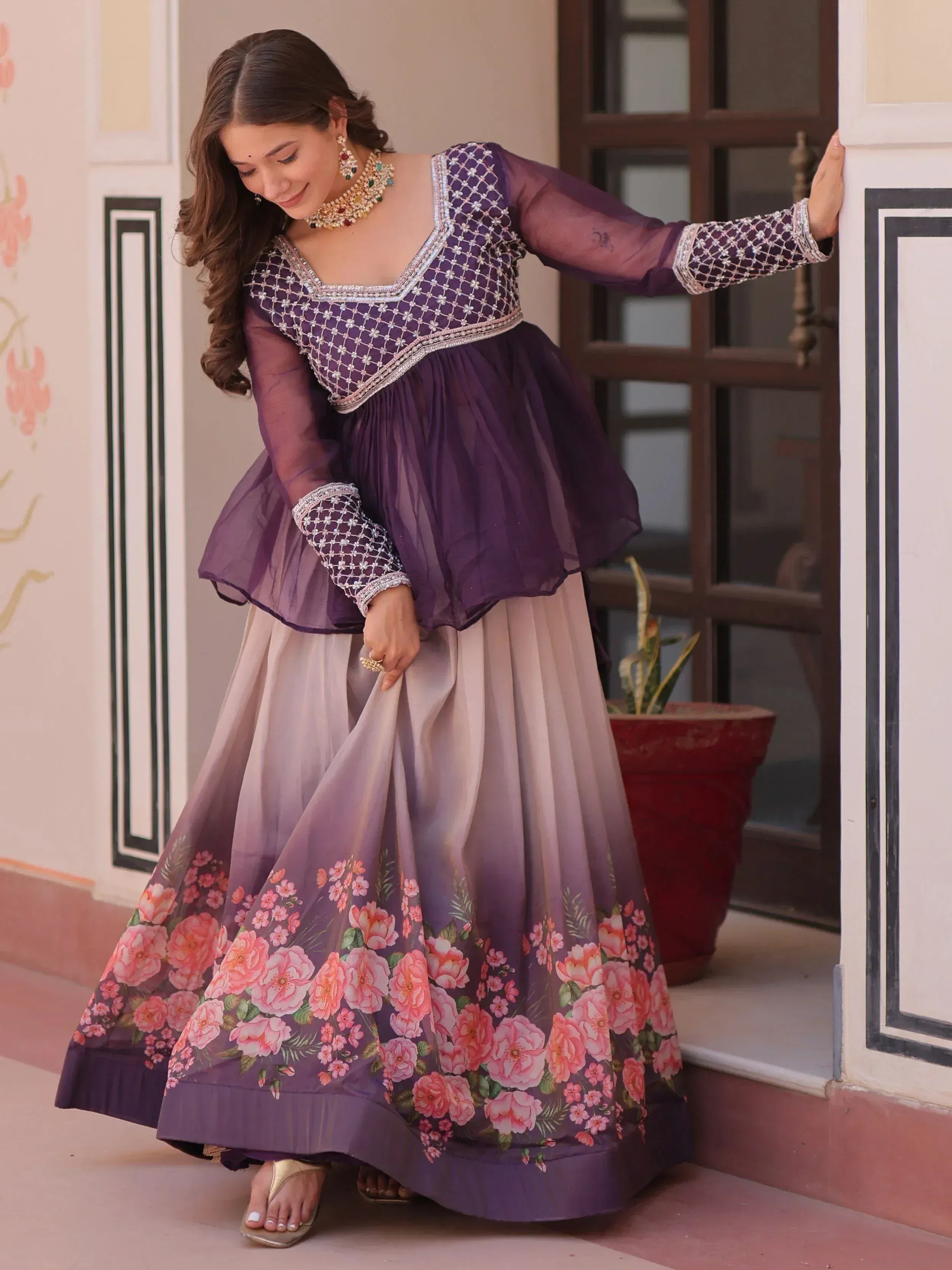Purple floral printed ethnic gown with embroidered blouse, perfect for Indian celebrations and festive occasions.