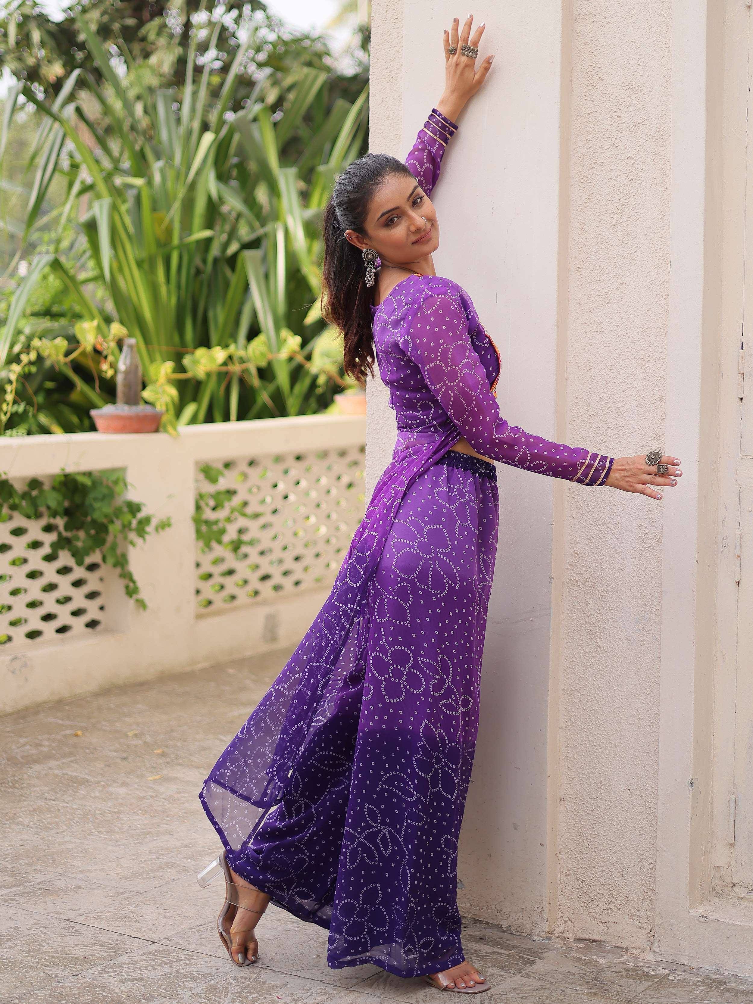 Purple ethnic gown with white patterns, perfect for Indian wear and festive occasions.