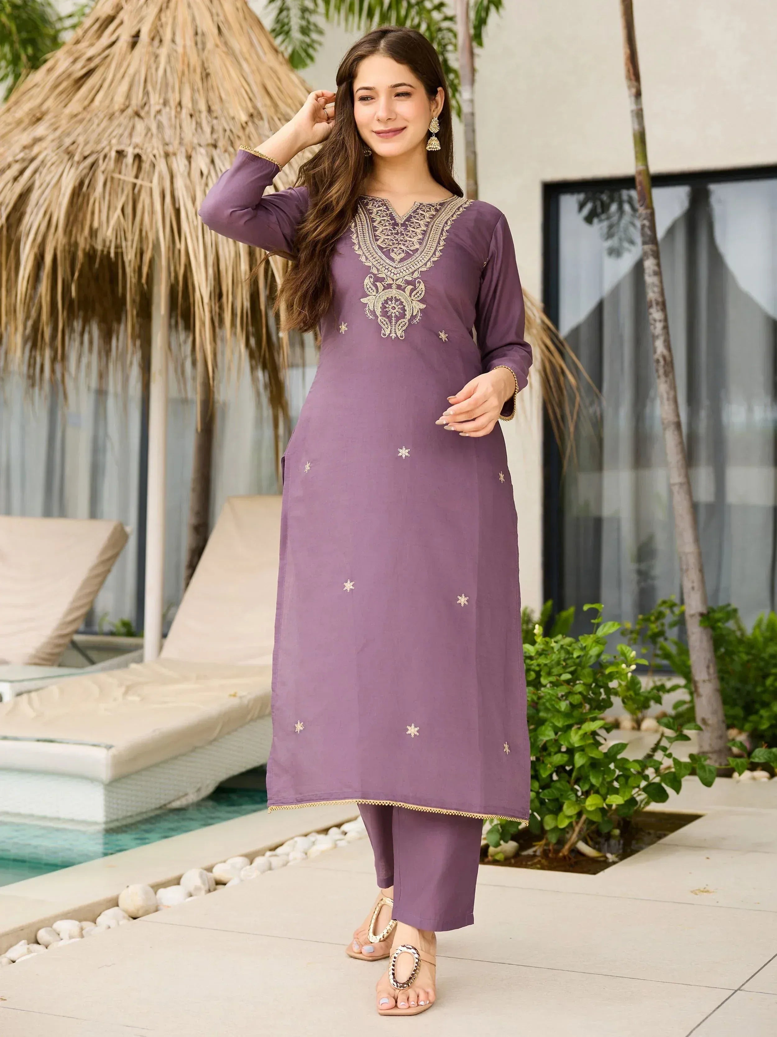 Purple embroidered kurta set with gold detailing, perfect for ethnic wear occasions