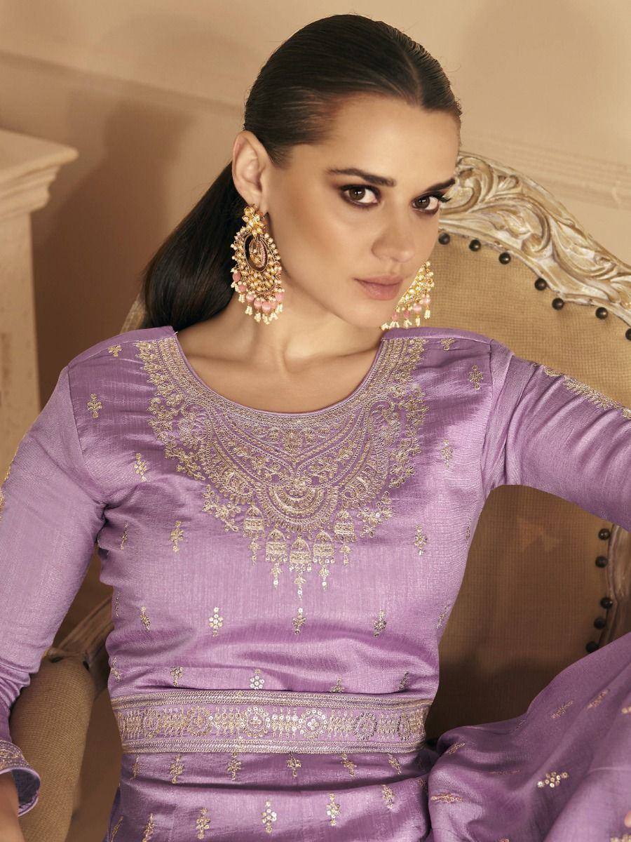 Purple ethnic salwar kameez with gold embroidery, paired with statement earrings for festive occasions
