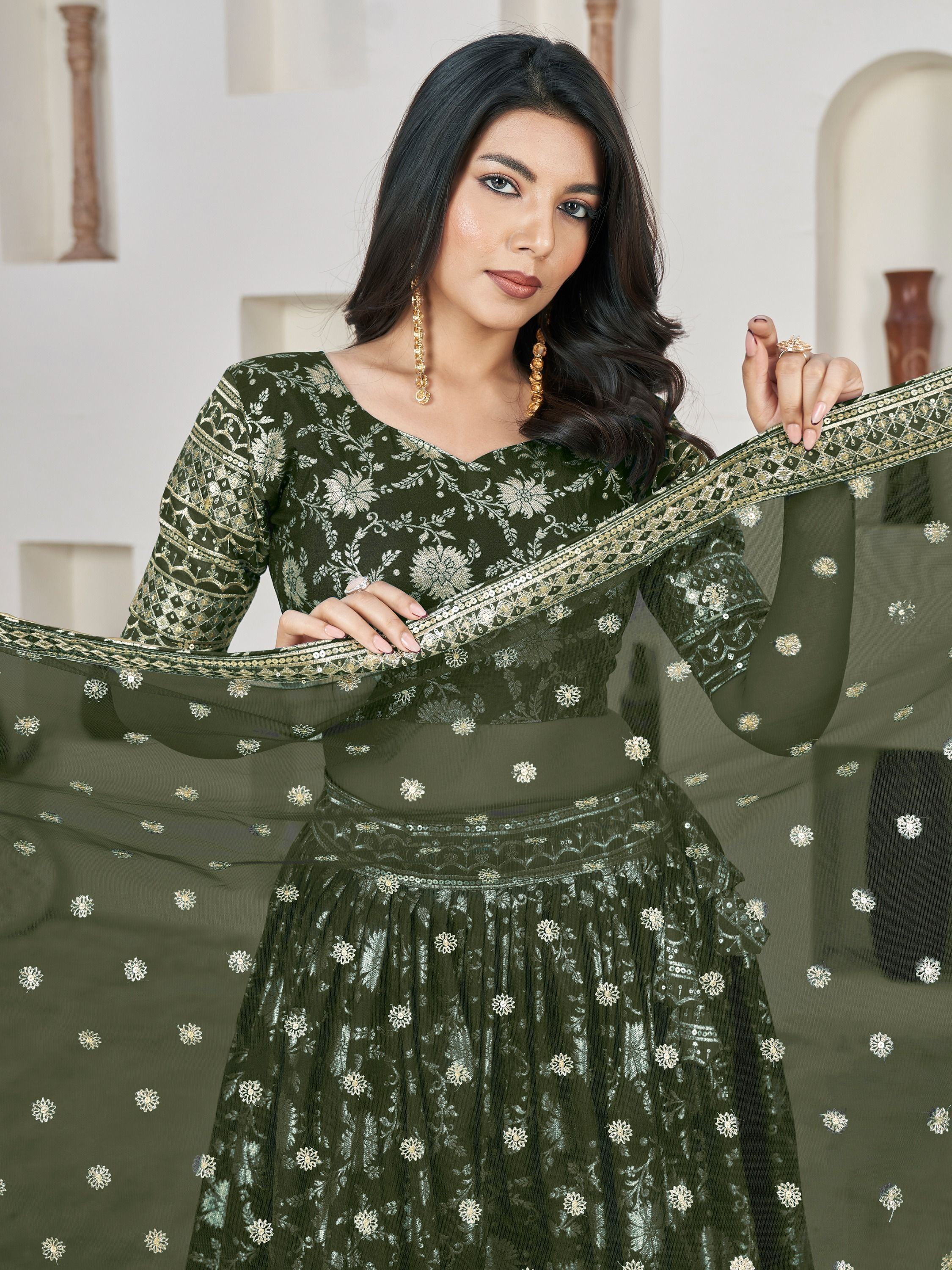 Olive green embroidered lehenga choli with floral zari work and sheer dupatta, perfect for Indian ethnic occasions.