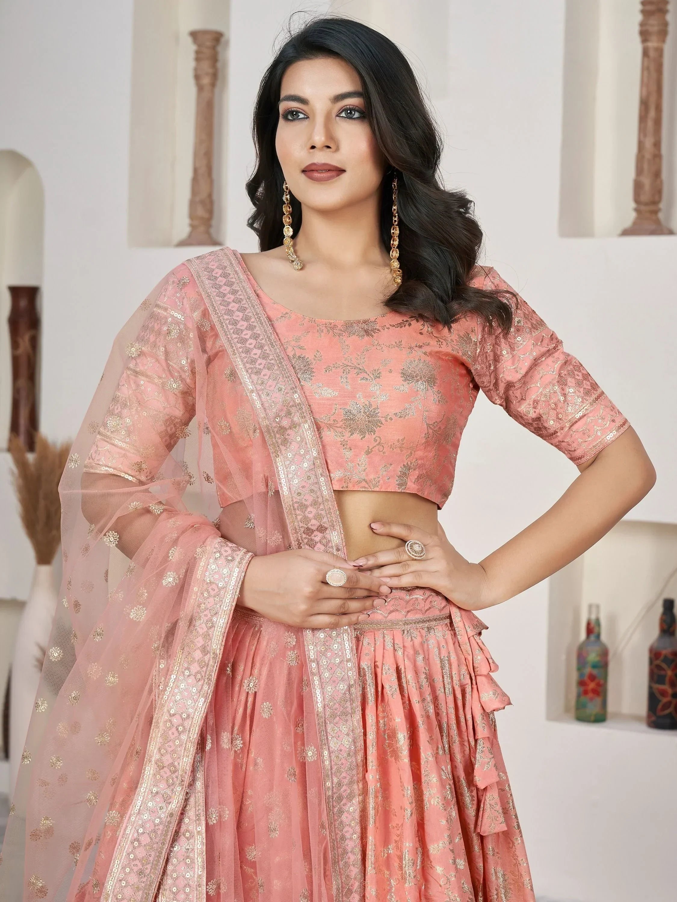 Pink designer lehenga choli with gold embroidery and sheer dupatta, perfect for Indian ethnic occasions