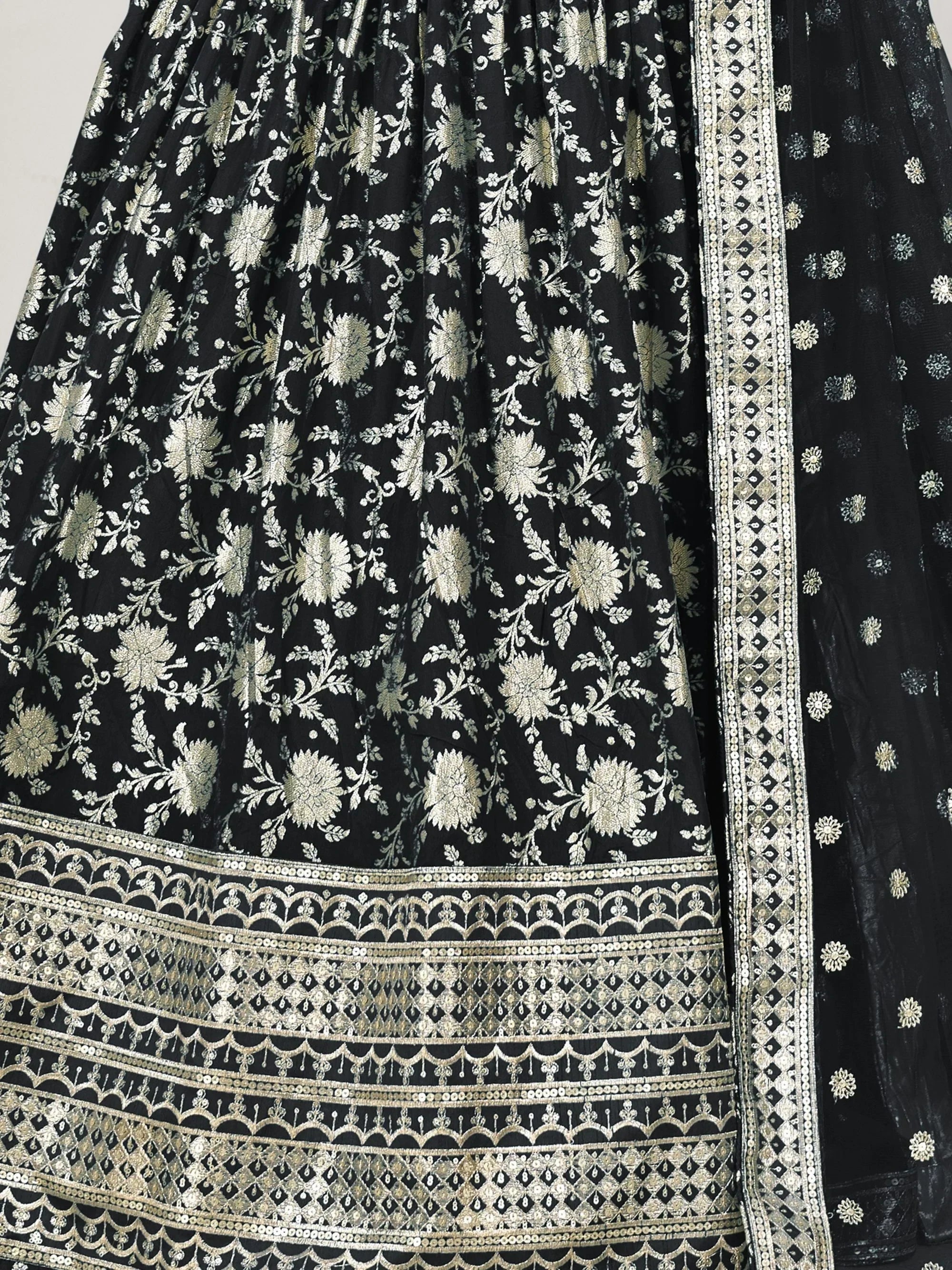 Black floral embroidered lehenga with gold zari work and detailed border, perfect for Indian ethnic wear.