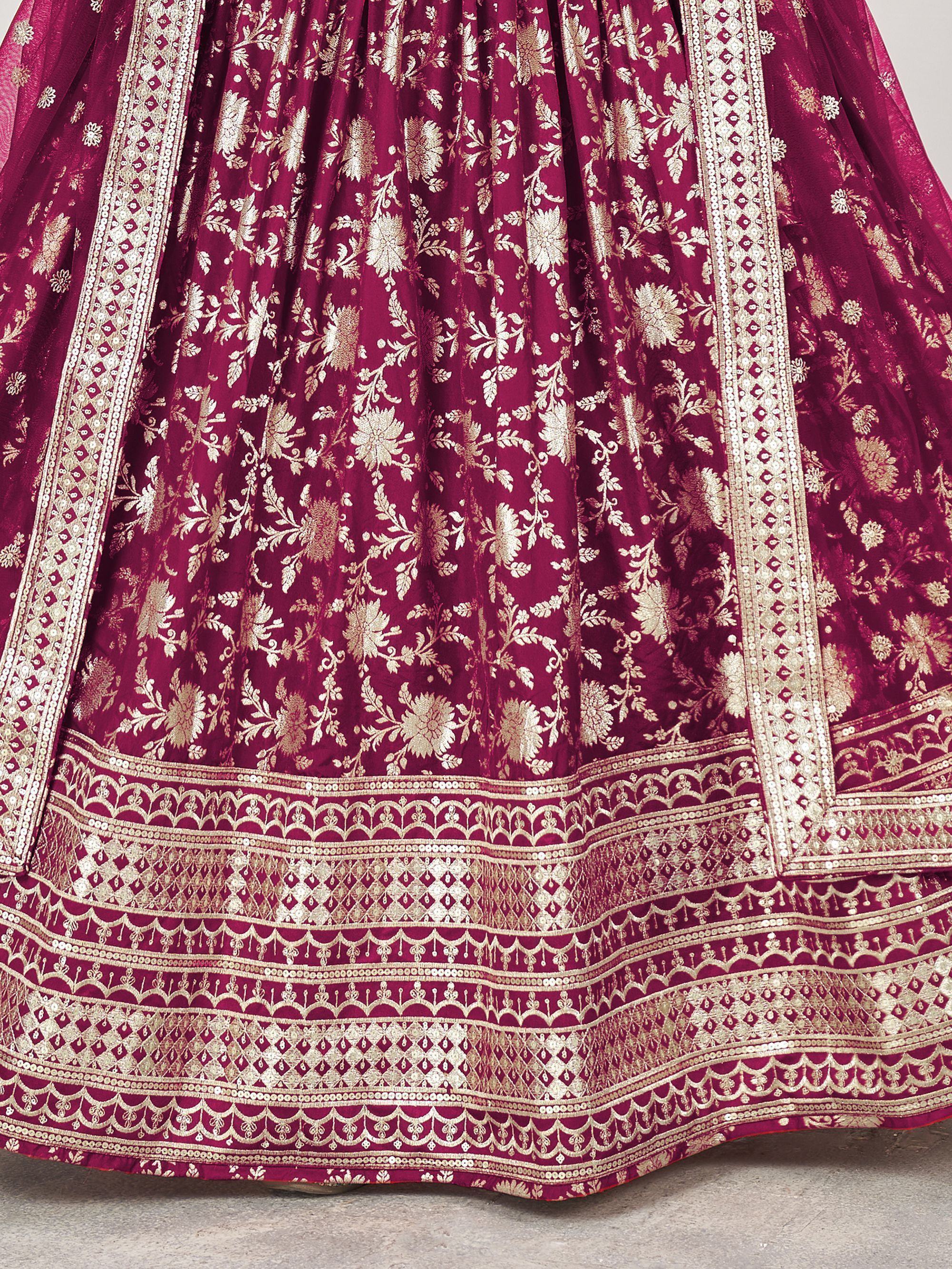 Rich maroon lehenga with intricate gold floral embroidery and detailed border work, perfect for Indian ethnic wear.