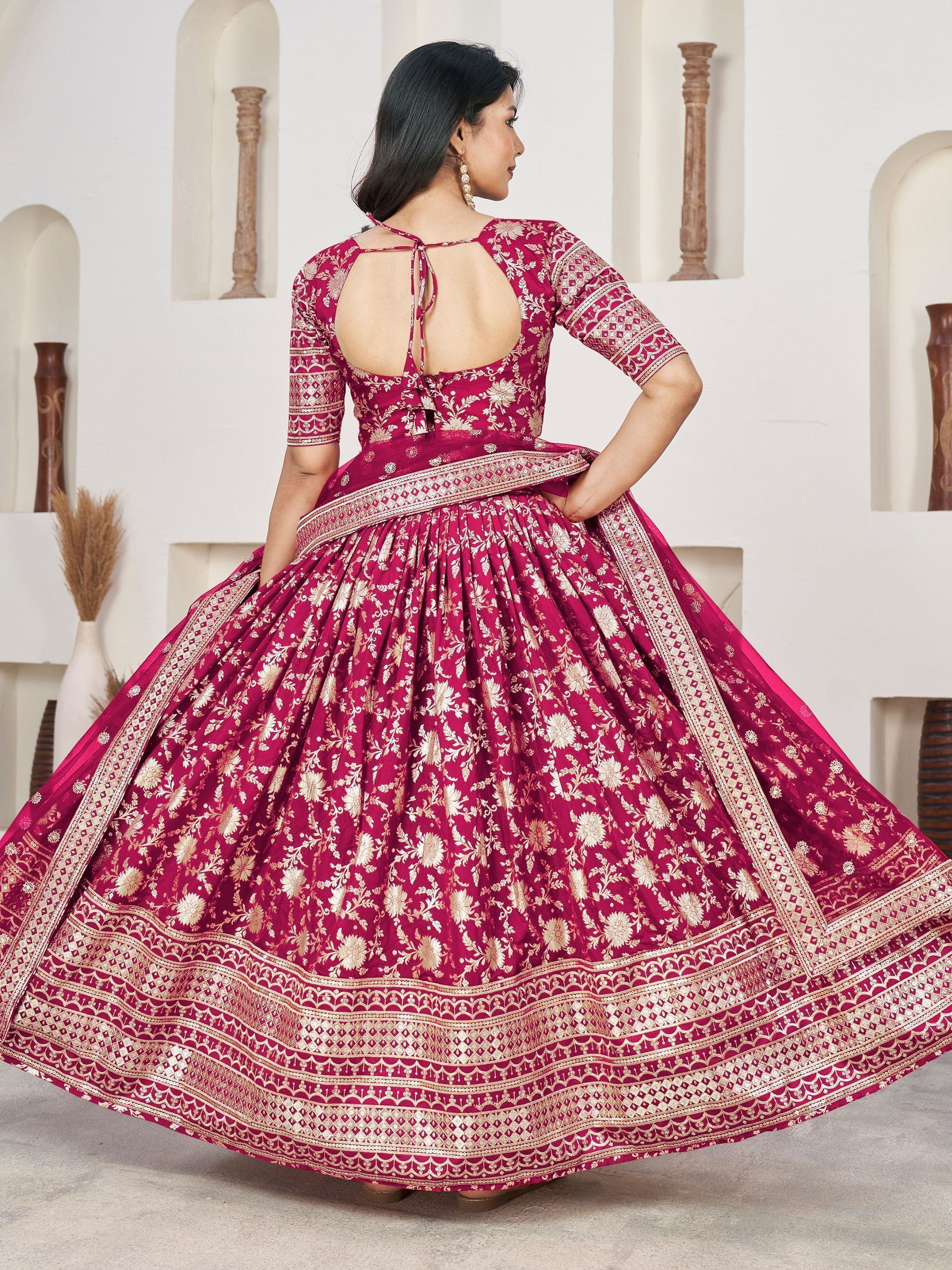 Maroon designer lehenga choli with gold floral embroidery and open back, ethnic Indian wear
