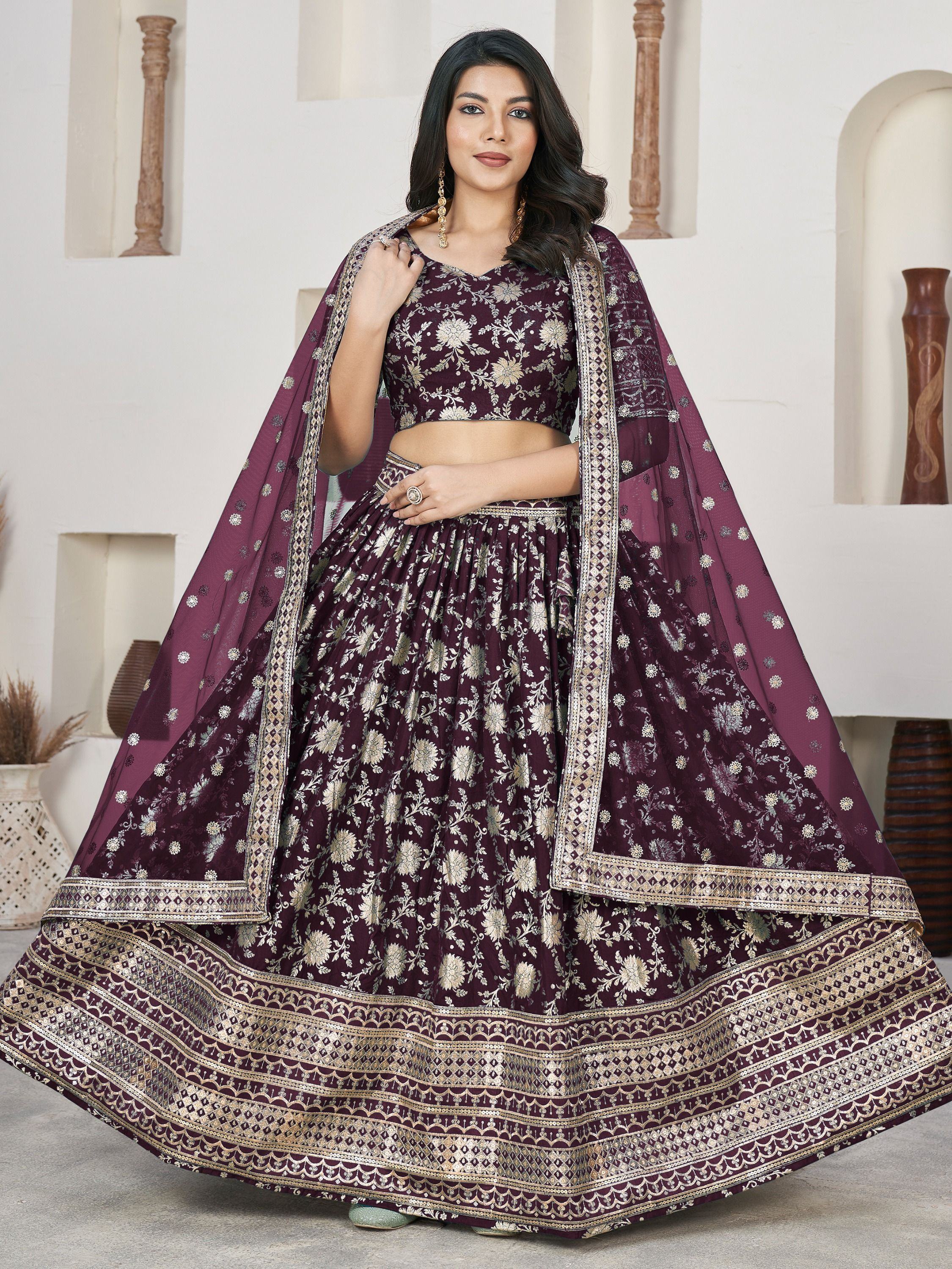 Elegant maroon lehenga choli with gold floral embroidery and matching dupatta for Indian ethnic wear