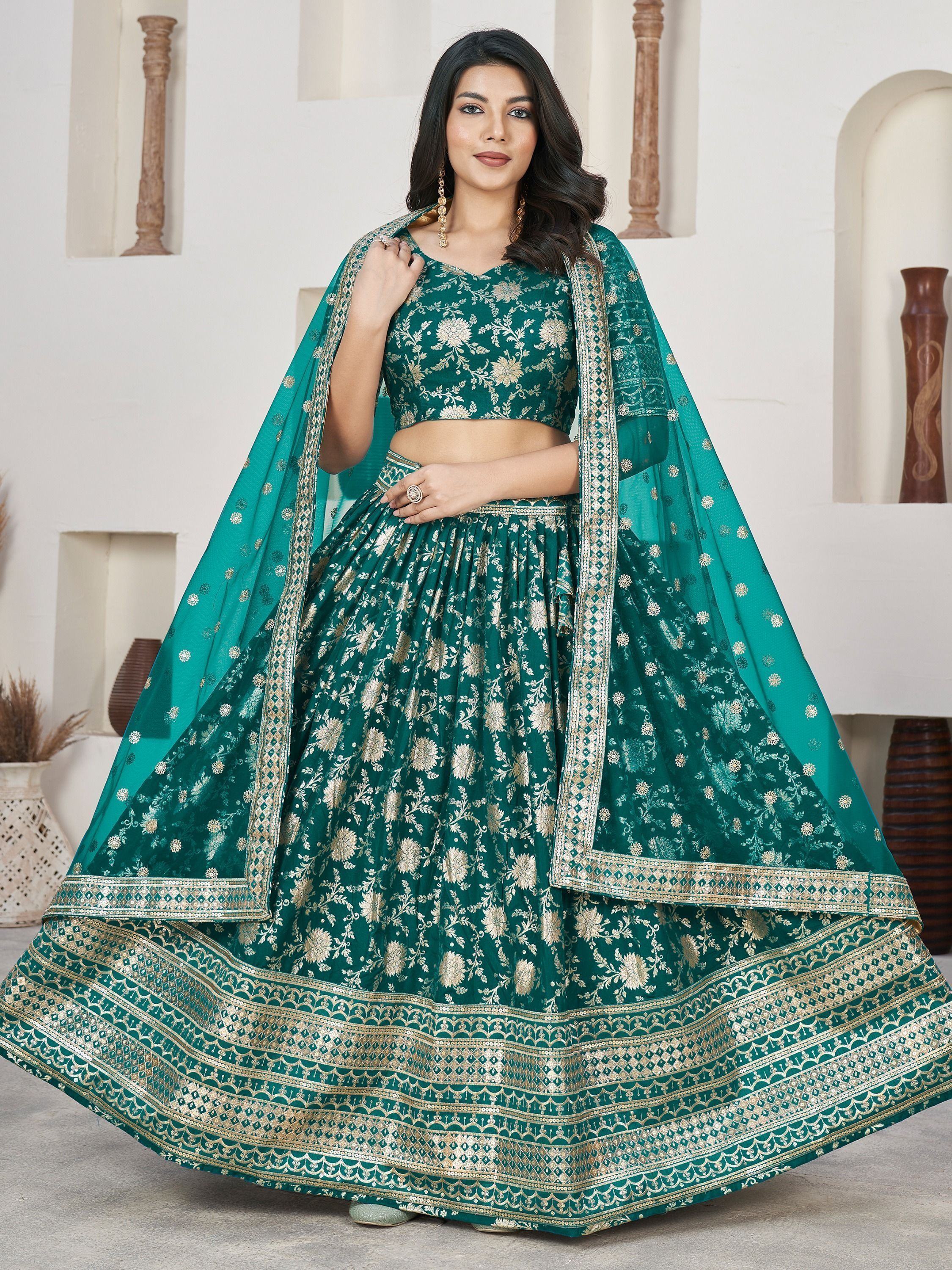 Emerald green designer lehenga choli with gold floral embroidery and dupatta, perfect for Indian ethnic occasions