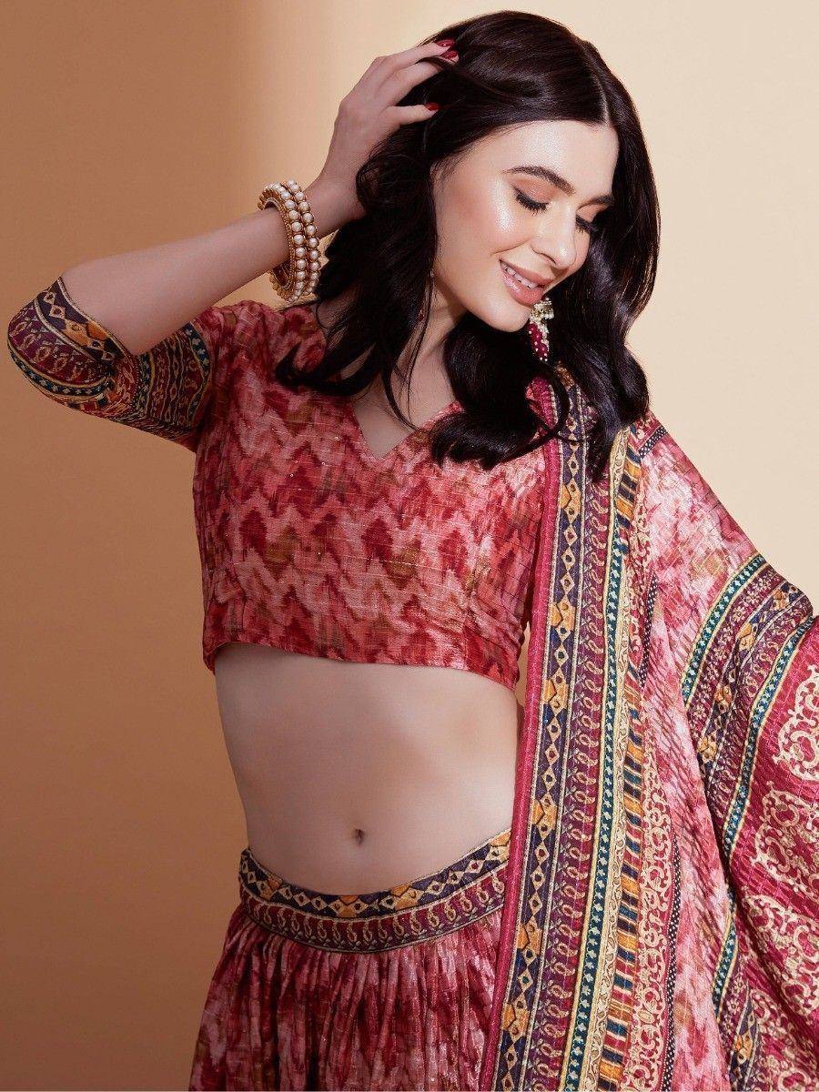 Woman in red printed ethnic lehenga choli with dupatta, traditional Indian wear for festive occasions