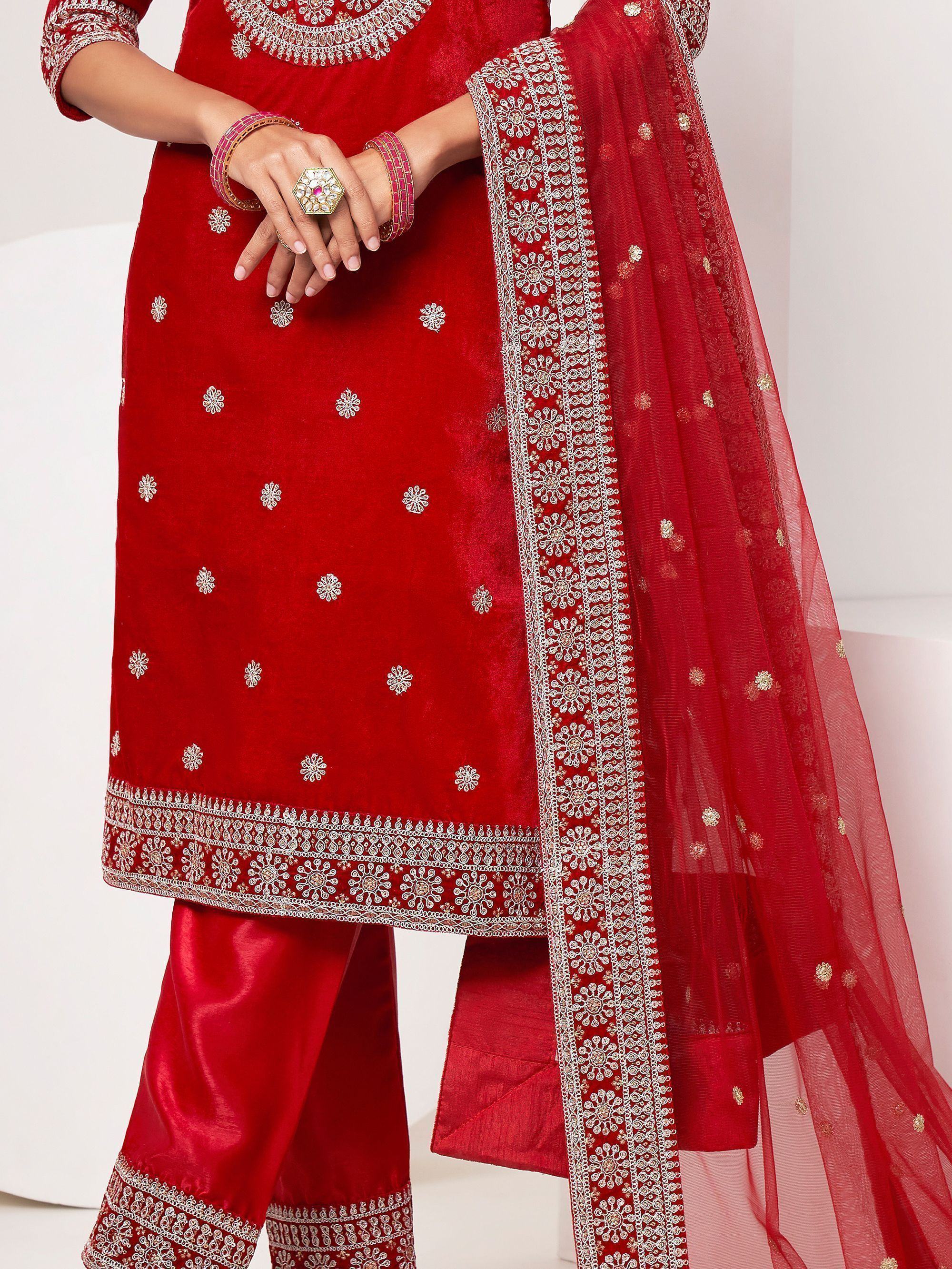 Red embroidered salwar kameez with sheer dupatta and silver floral patterns