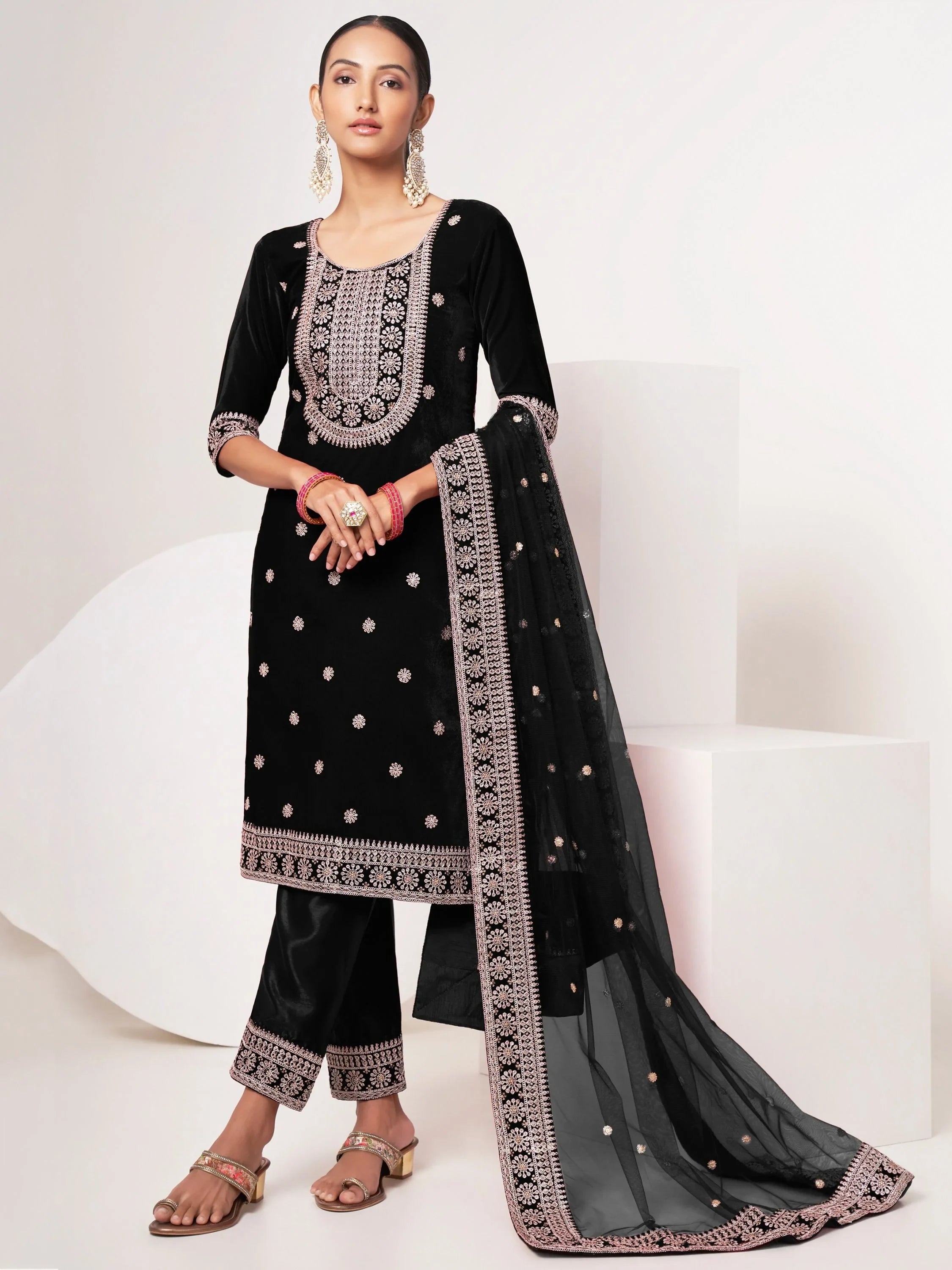 Woman wearing black embroidered salwar kameez with matching dupatta, ethnic Indian wear