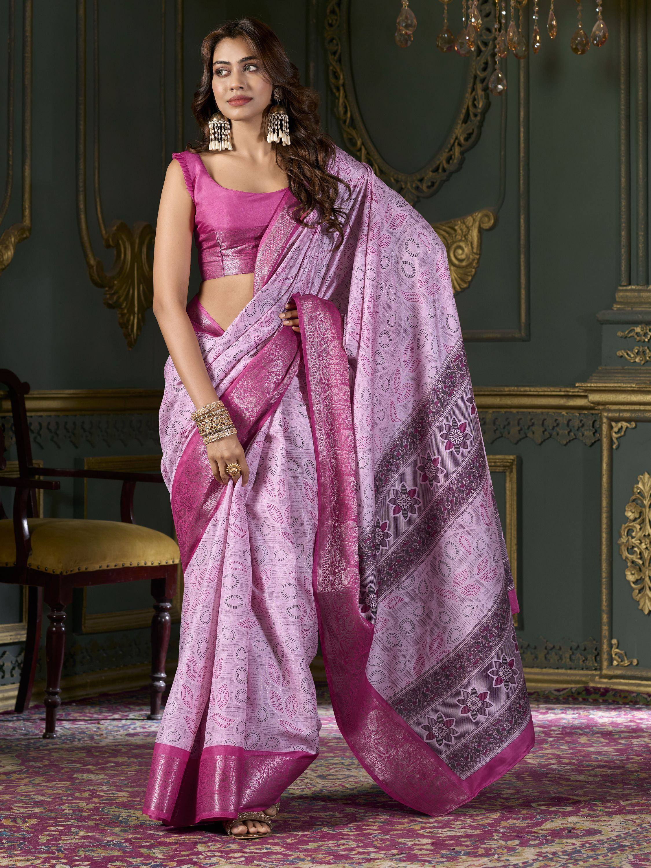 Elegant pink designer saree with floral border, paired with matching blouse, perfect for Indian ethnic occasions.