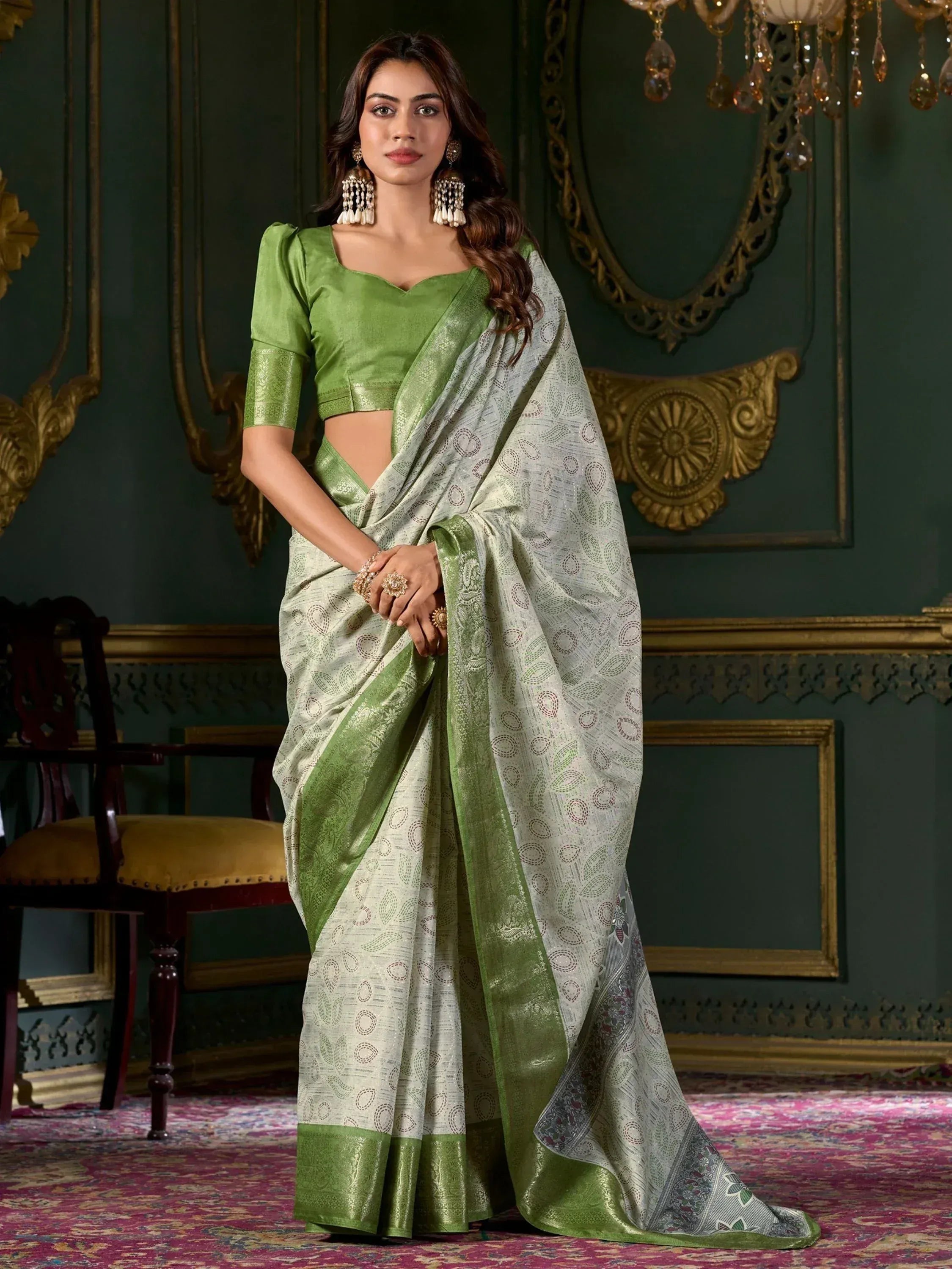 Elegant green and silver designer saree with intricate patterns, perfect for Indian ethnic wear occasions.