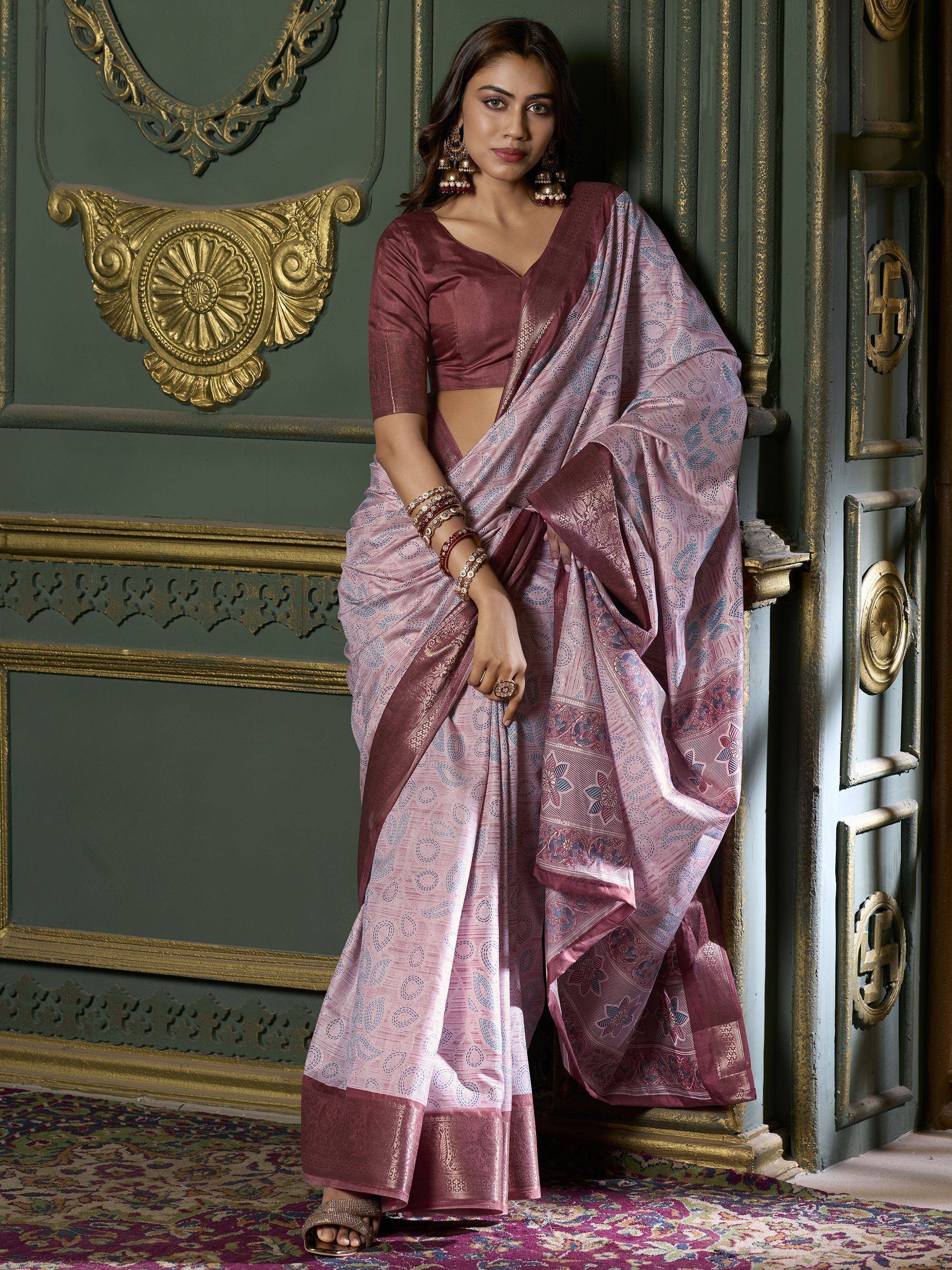 Elegant pink and maroon designer saree with intricate patterns, perfect for Indian ethnic wear occasions.