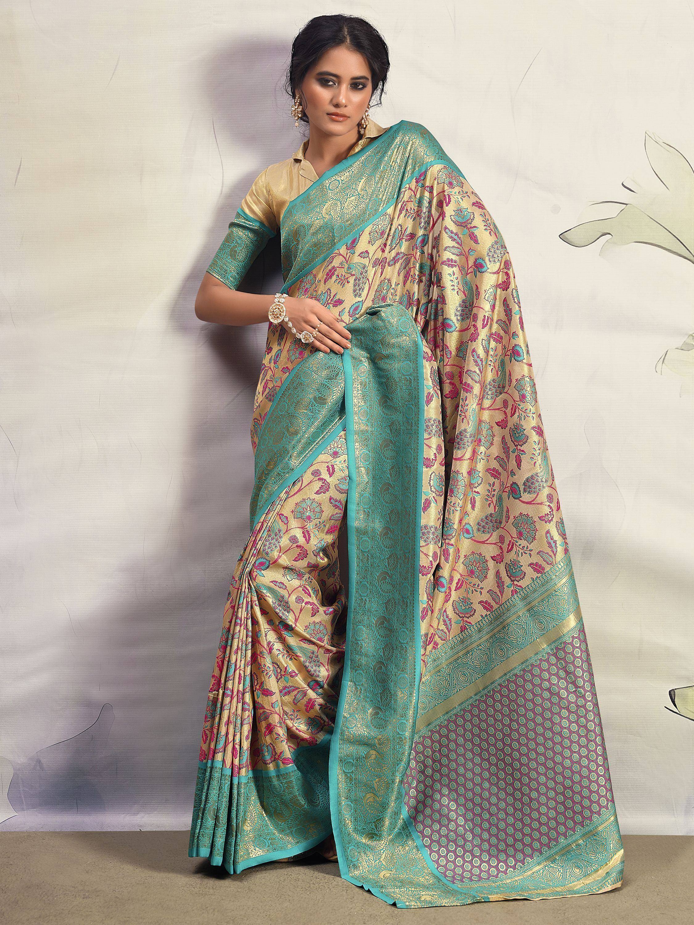 Elegant gold and teal floral saree with intricate border, perfect for Indian ethnic wear occasions