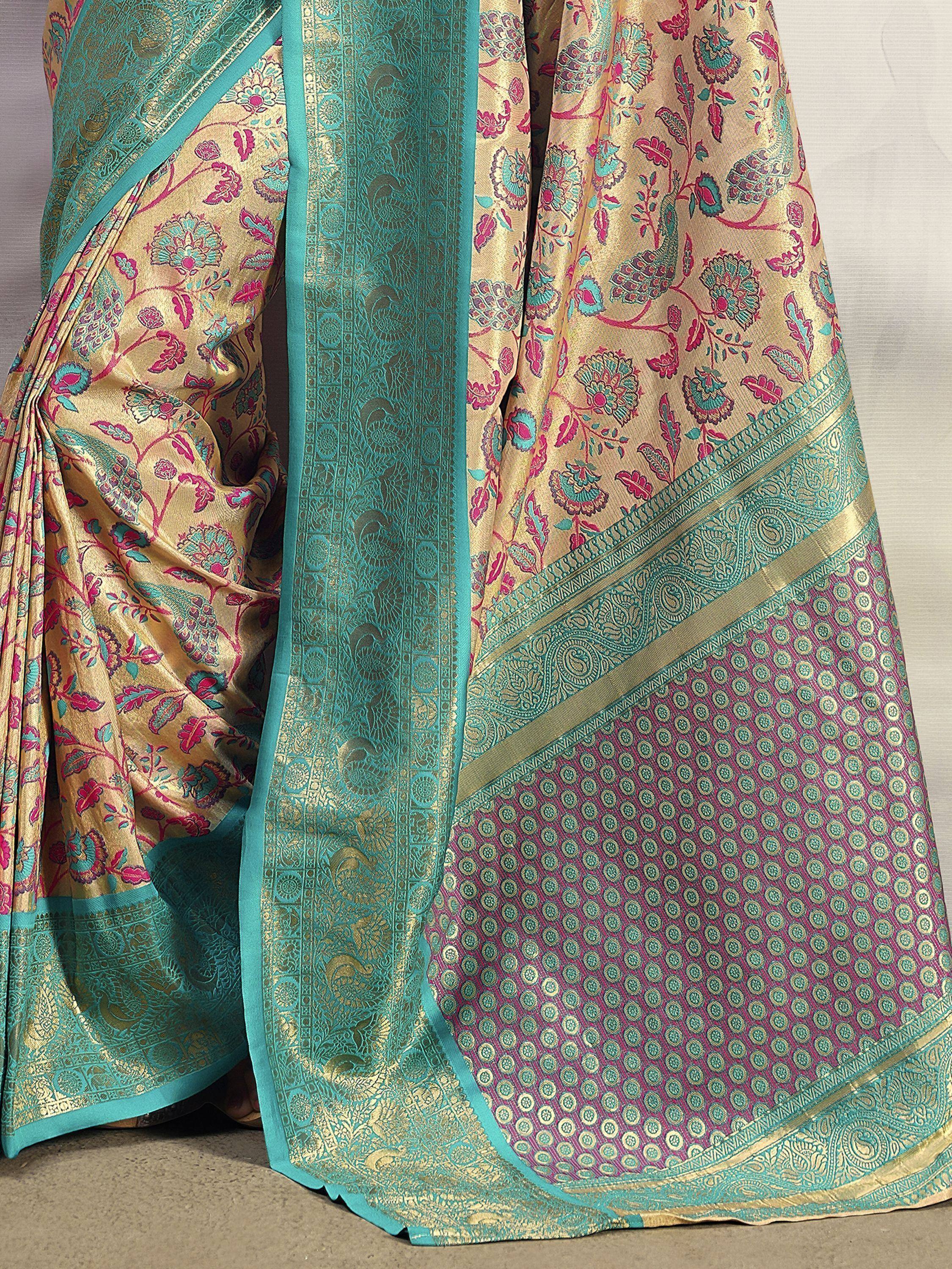Gold and teal designer saree with floral and peacock motifs, perfect for Indian ethnic wear