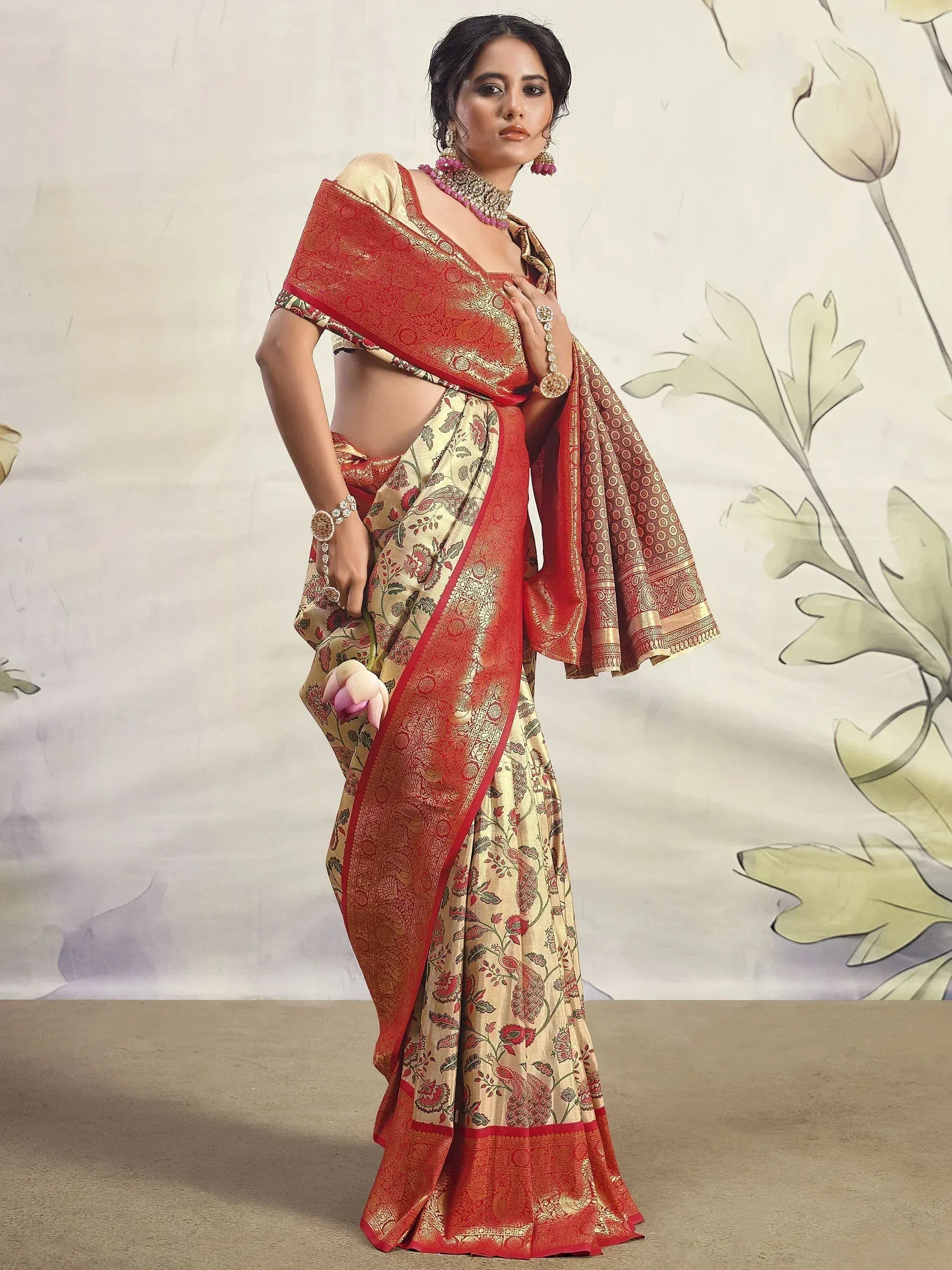 Elegant Indian saree with red and gold floral print, perfect for weddings and festivals