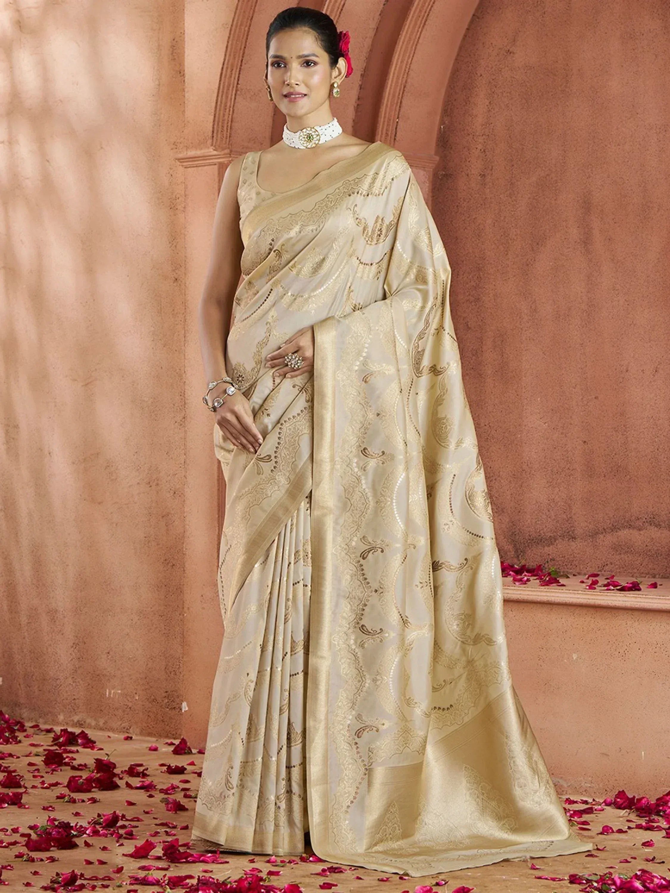 Elegant cream saree with gold embroidery, perfect for Indian ethnic wear and festive occasions.