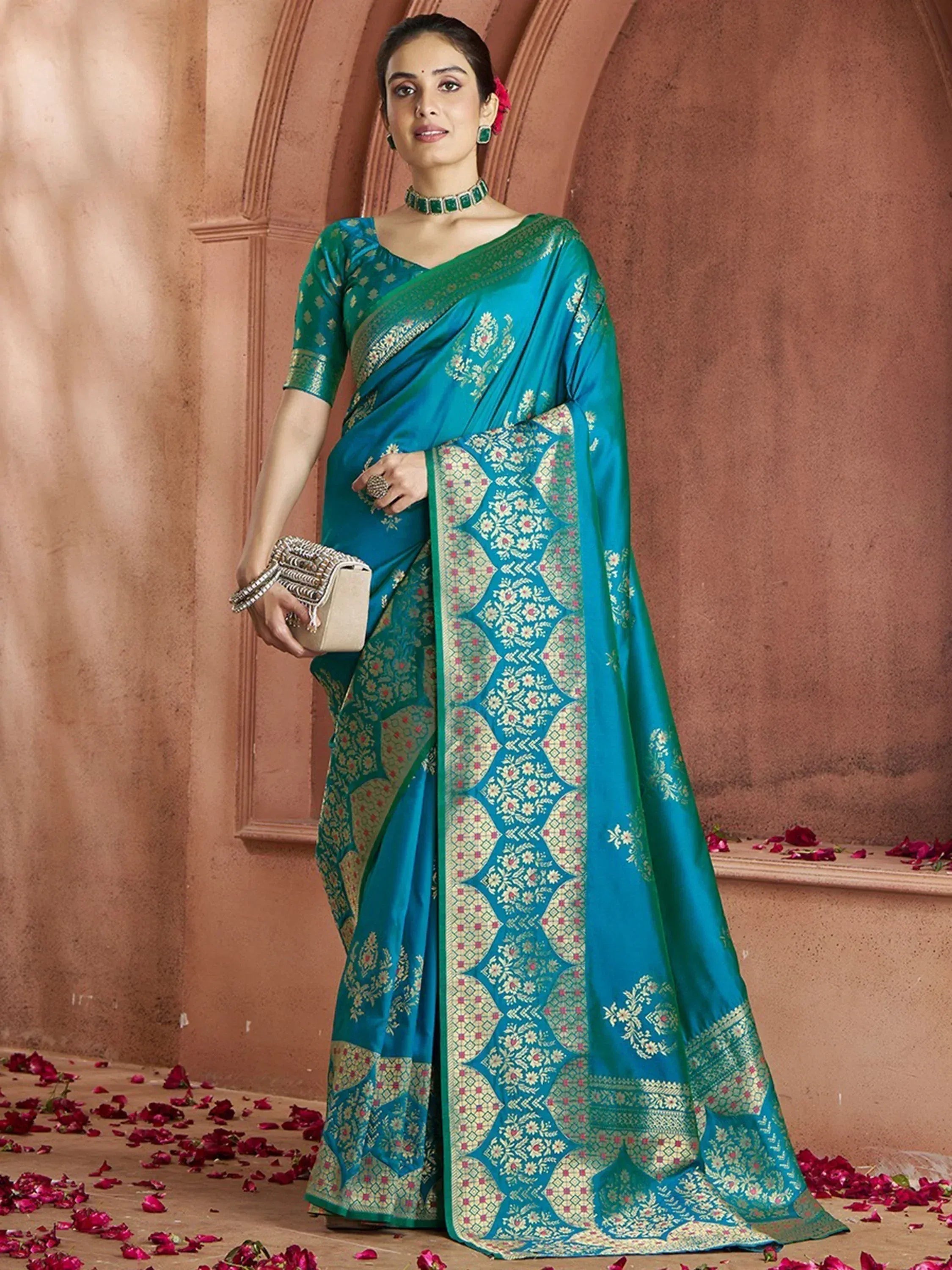 Teal designer saree with gold floral embroidery, perfect for Indian ethnic wear occasions