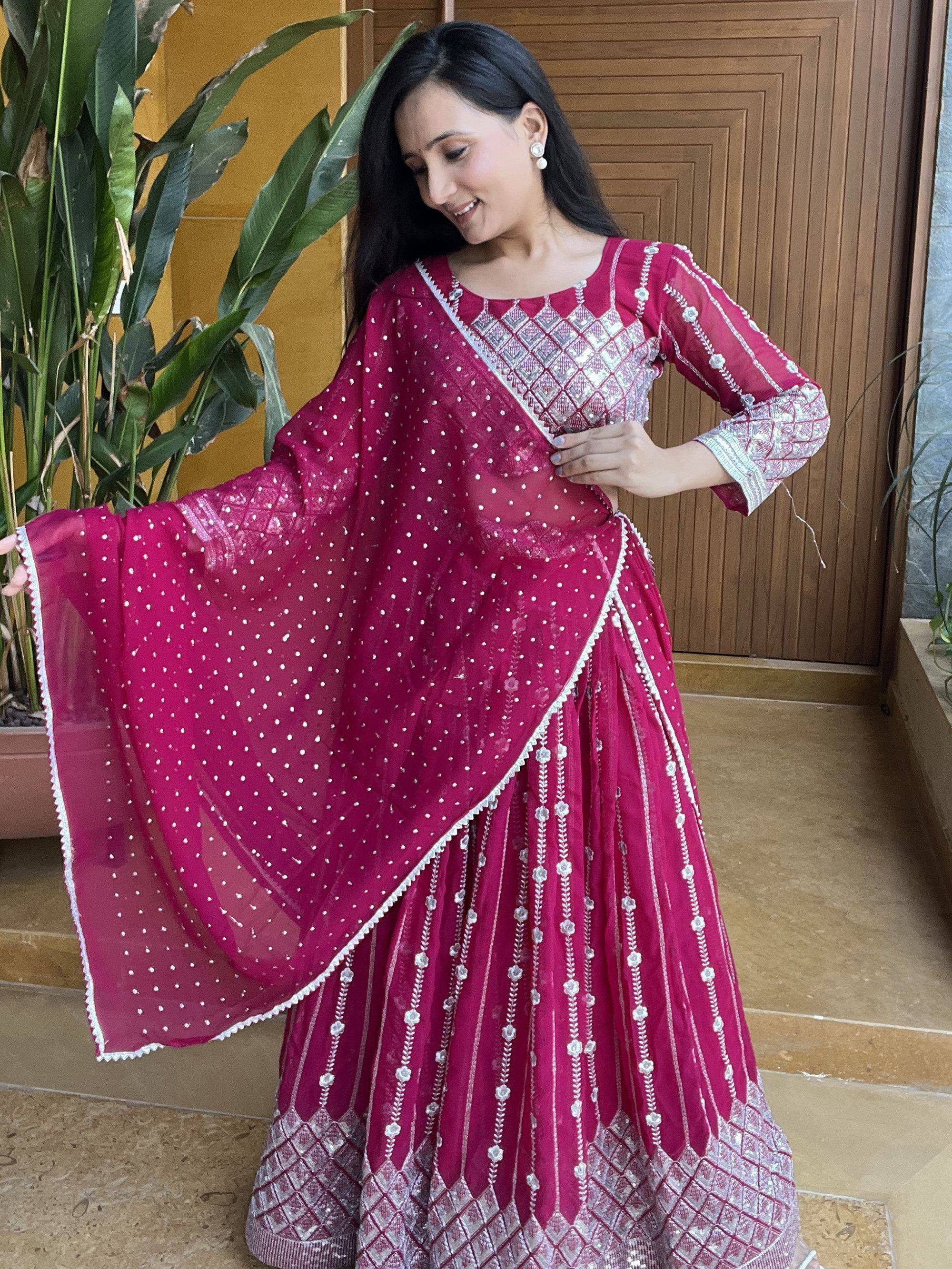 Woman in maroon embroidered lehenga choli with sheer dupatta, Indian ethnic wear