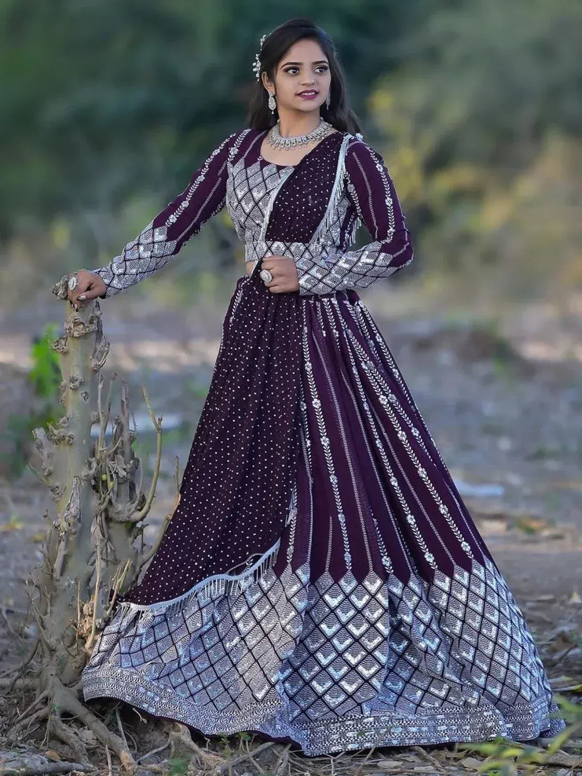 Elegant maroon and silver designer lehenga choli with intricate embroidery, perfect for Indian ethnic wear occasions.