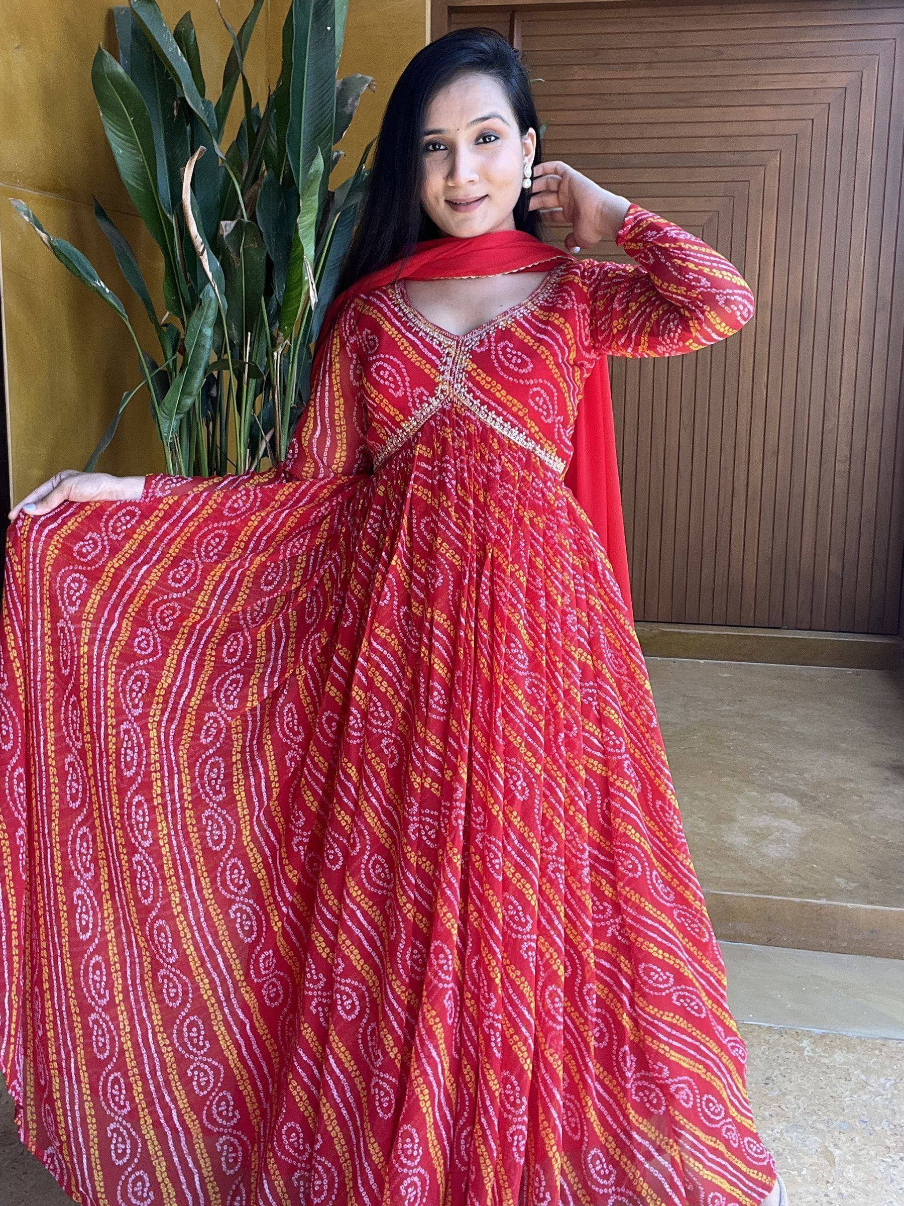 Red printed ethnic gown with gold and white patterns, perfect for Indian occasions