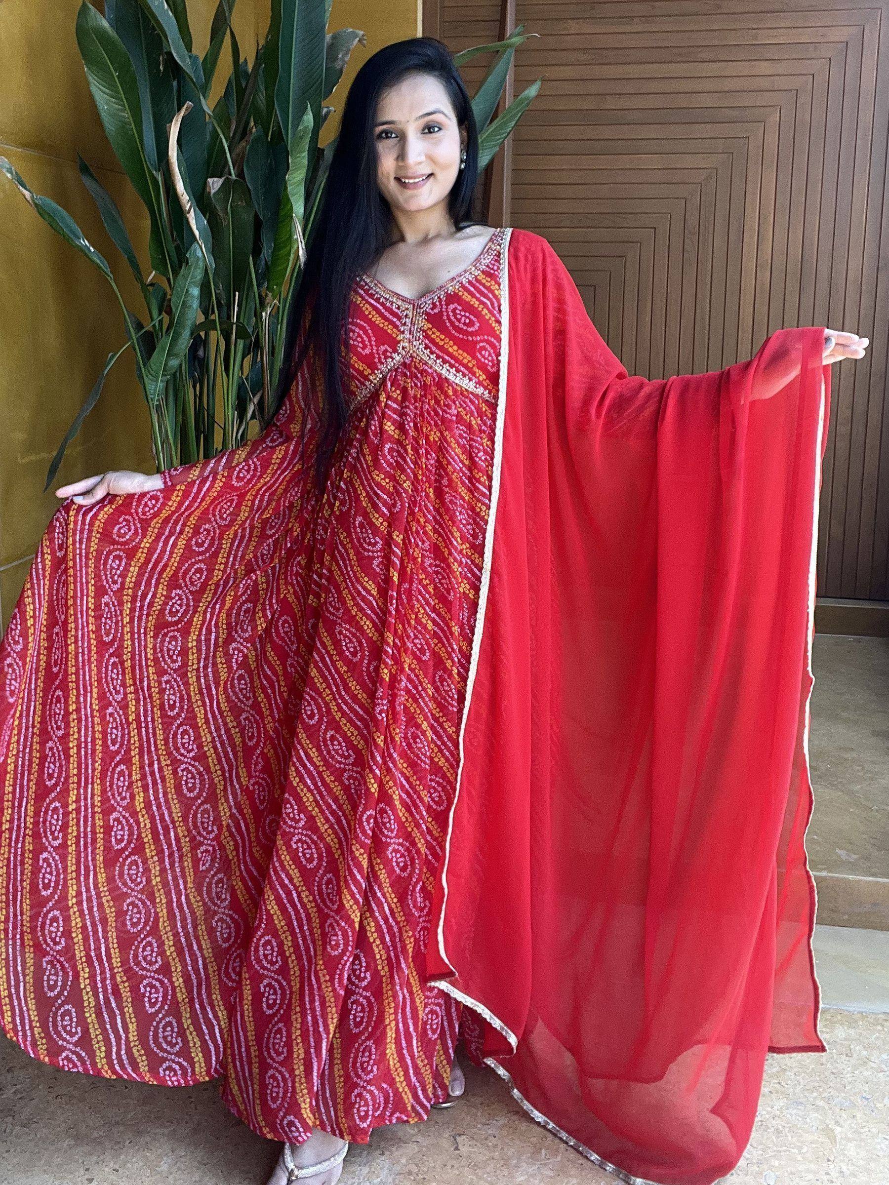 Red printed ethnic gown with cape sleeve, perfect for Indian festive occasions and parties