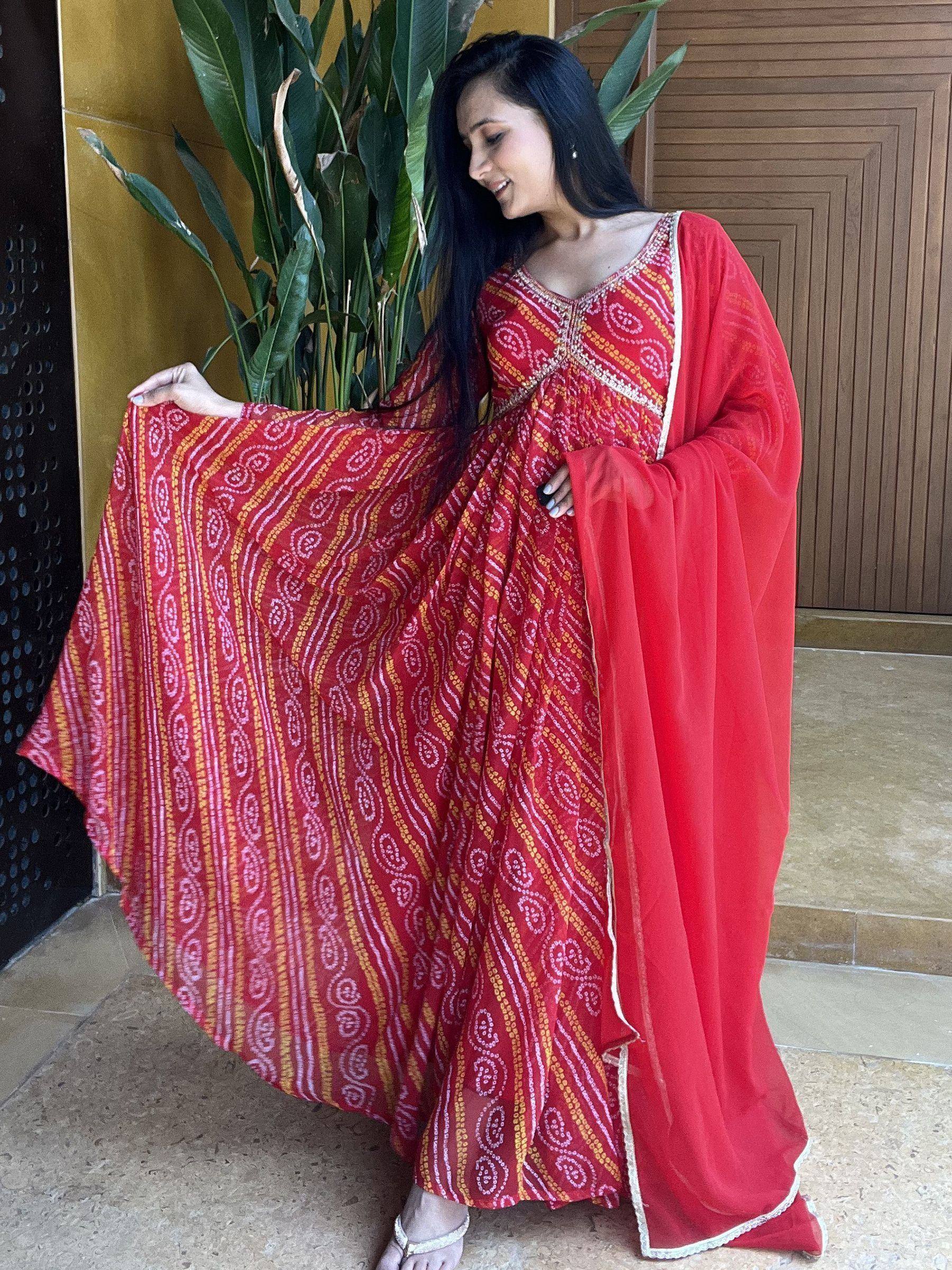Red printed ethnic gown with gold and white patterns, perfect for Indian occasions