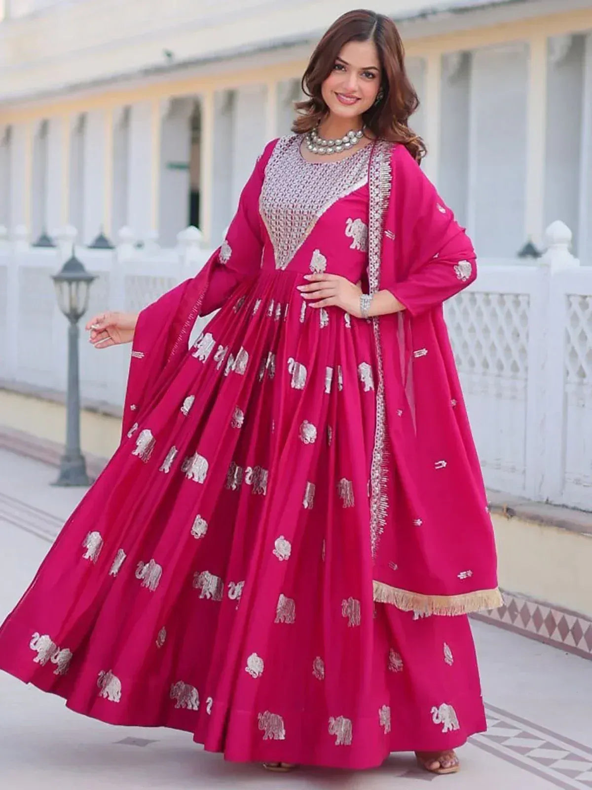 Pink ethnic anarkali suit with elephant print and silver embroidery, perfect for Indian festive occasions
